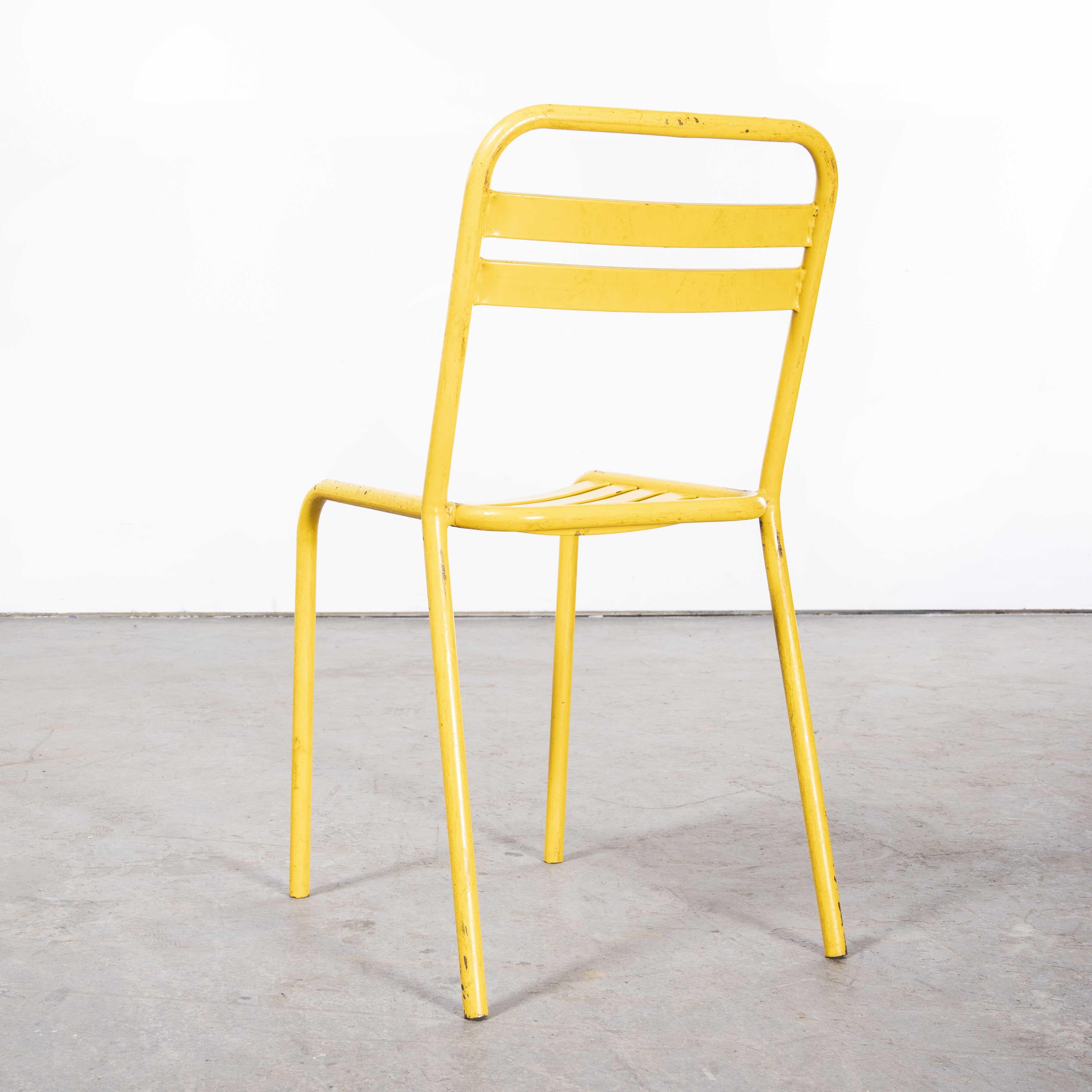 1950's Original Yellow French Tolix T2 Metal Café Dining Chairs - Pair

1950's Original Yellow French Tolix T2 Metal Café Dining Chairs - Pair. Please note the images show four chairs but the listing is just for the last two chairs we have. Tolix is