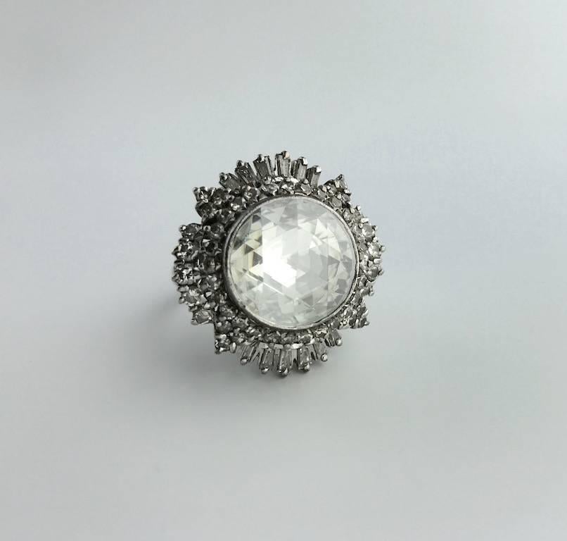 Rare and Collectable! This Antique Rose cut Diamond is clean and white.
The mounting is an Indian work with round and baguette cut diamond.
The diameter of the central diamond is approximately 15.00 millimeters.
Circa 1950.