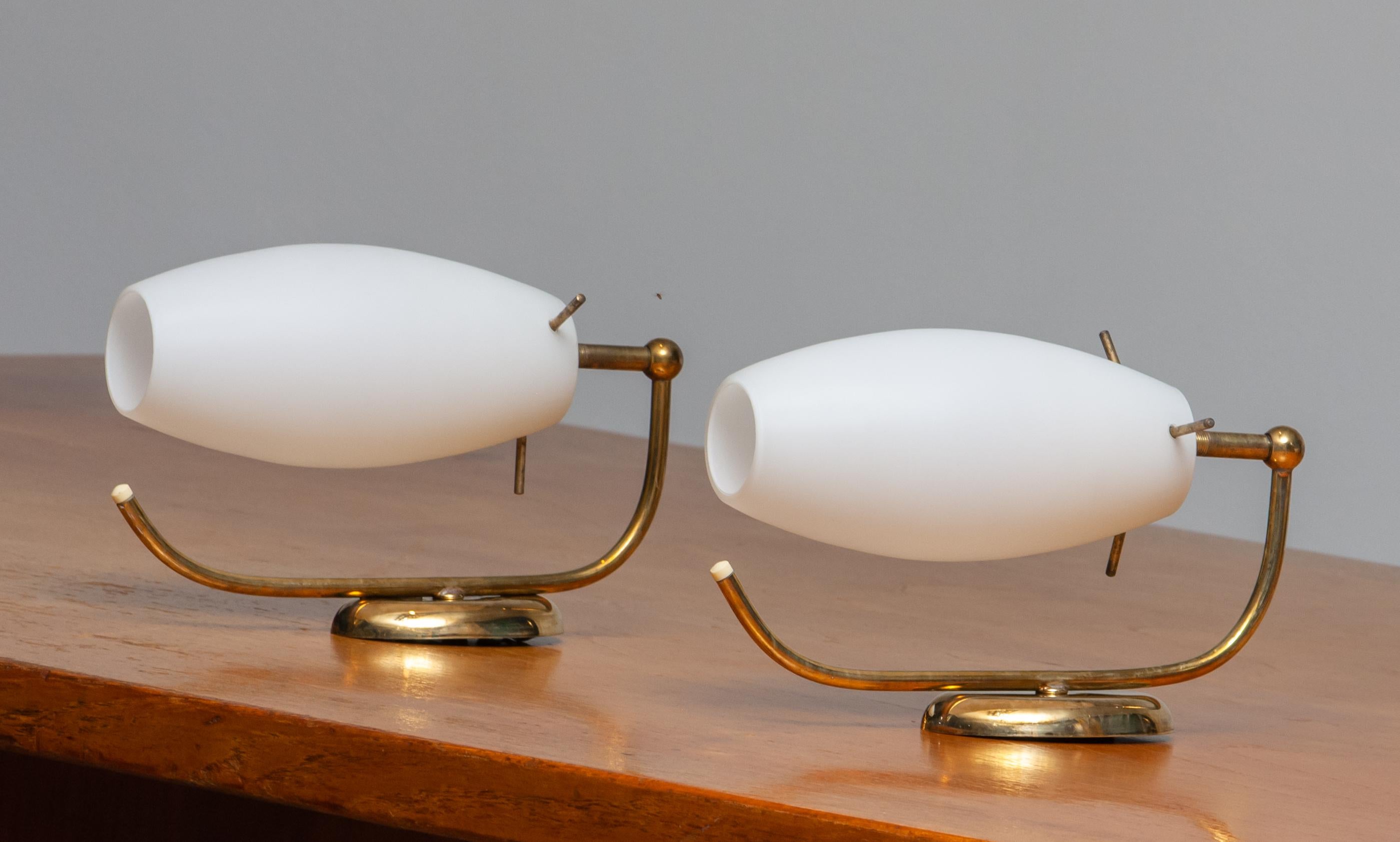 Beautiful set of two brass wall lights / lamps from the 1950s opaline vases made by Stilnovo Lainate Milan, Italy.
Technically 100% and the overall condition is good.
Bulb size is E 14 / E17 and suits 110 volts and 230 volts.
Note that we have