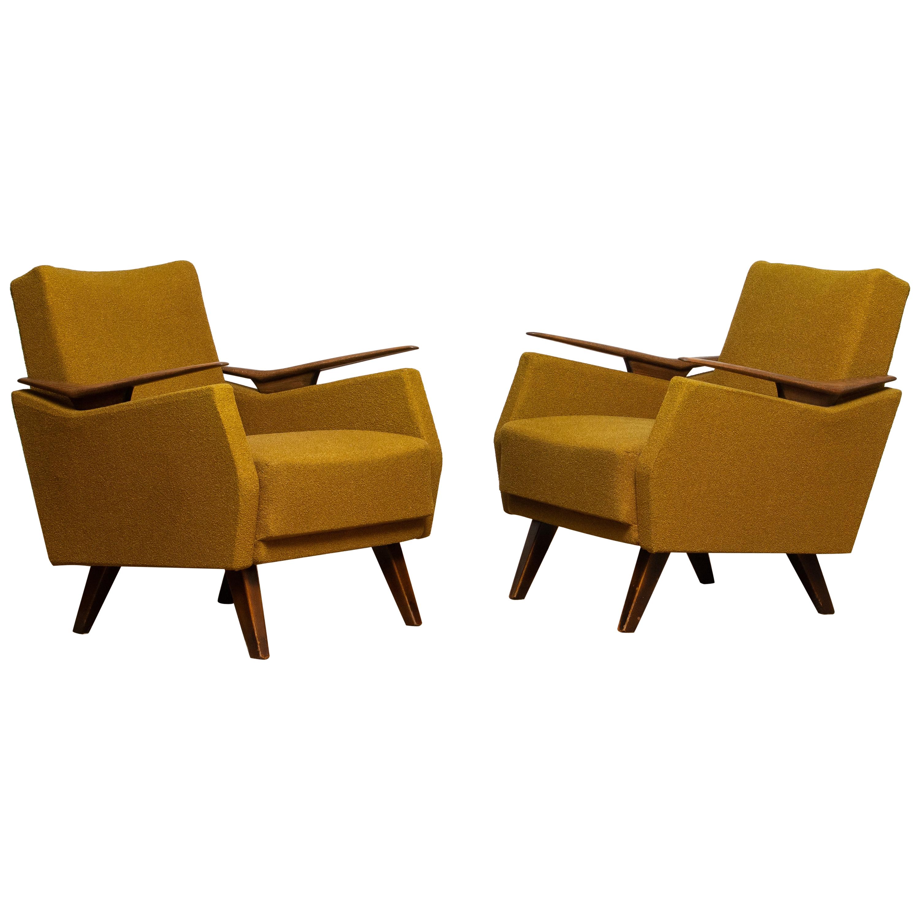 Beautiful and comfortable original set of two lounge / easy / club chairs from the '50s made in Germany. The chairs are upholstered with the original bouclé fabric which is still in good condition. The overall condition of both chairs is also