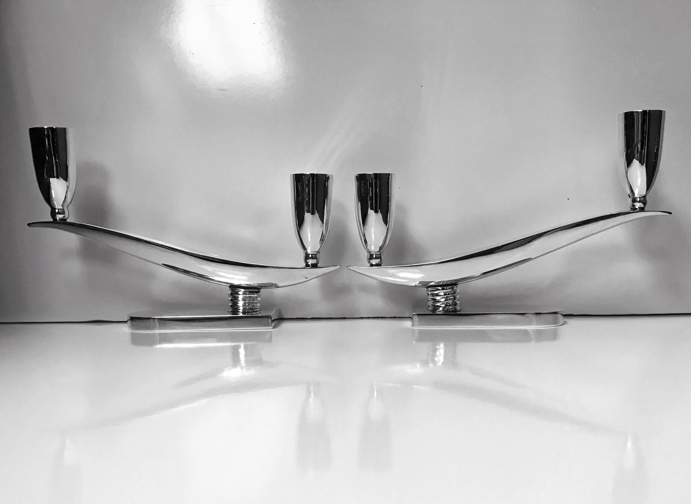 1950s pair of midcentury Mexican sterling silver two-light candelabra candlesticks Juventino Lopez Reyes, Art Deco style. The candelabra of plain swept form, in iconic Art Deco style, each with two plain, tulip shaped capitals. All surmounted on a