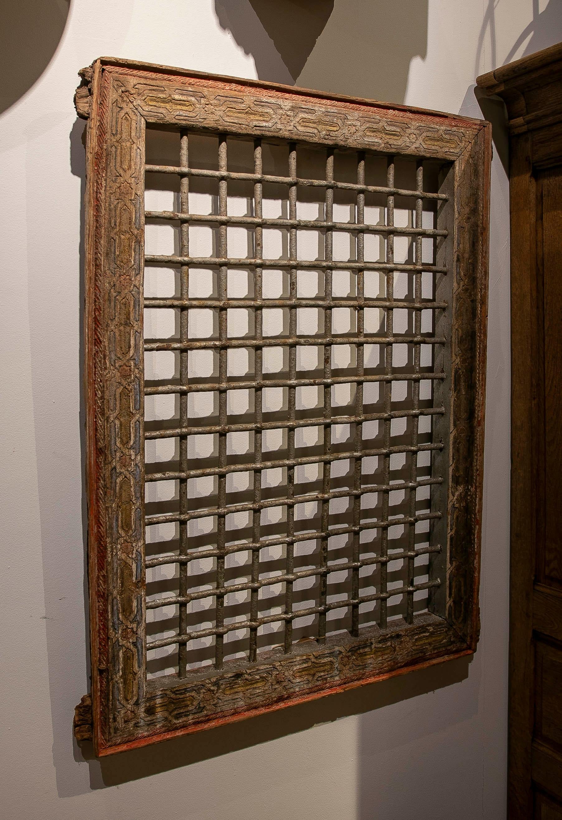 Moroccan 1950s Pair of Antique Carved Iron Grilles with Original Polychrome Frame For Sale
