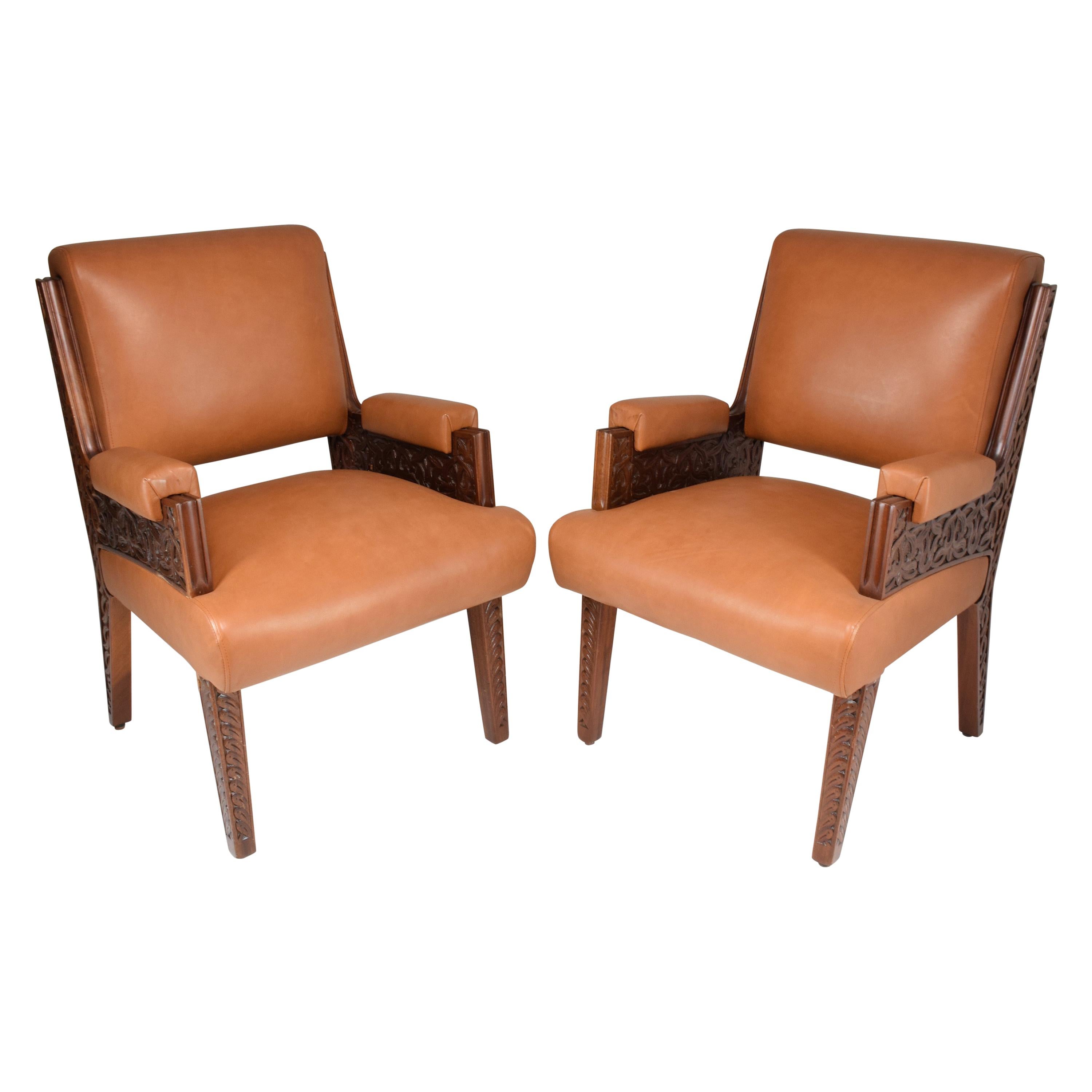 An exceptional set of two mid-century office or side armchairs that were produced for the Moroccan Royal secretary office in the 1950's. These collectible pieces are highlighted by their art deco design and intricate hand-carved Moorish wooden
