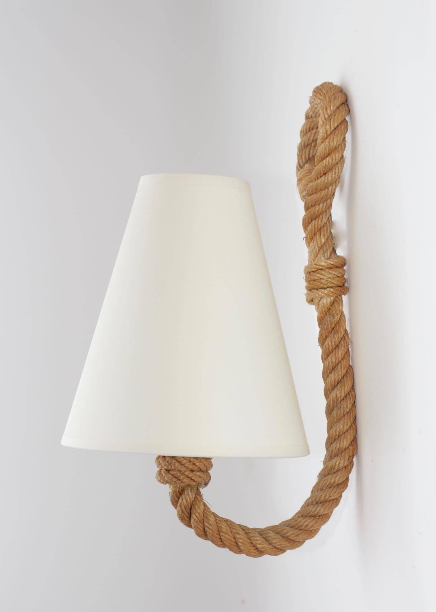 1950s pair of Adrien Audoux and Frida Minet. 

Each sconce consists of one lighted arm made of rope ended with handcrafted lampshade in off-white cotton.

One bulb per sconce.
Can be wire to the US standards.
Adrien Audoux and Frida Minet are known