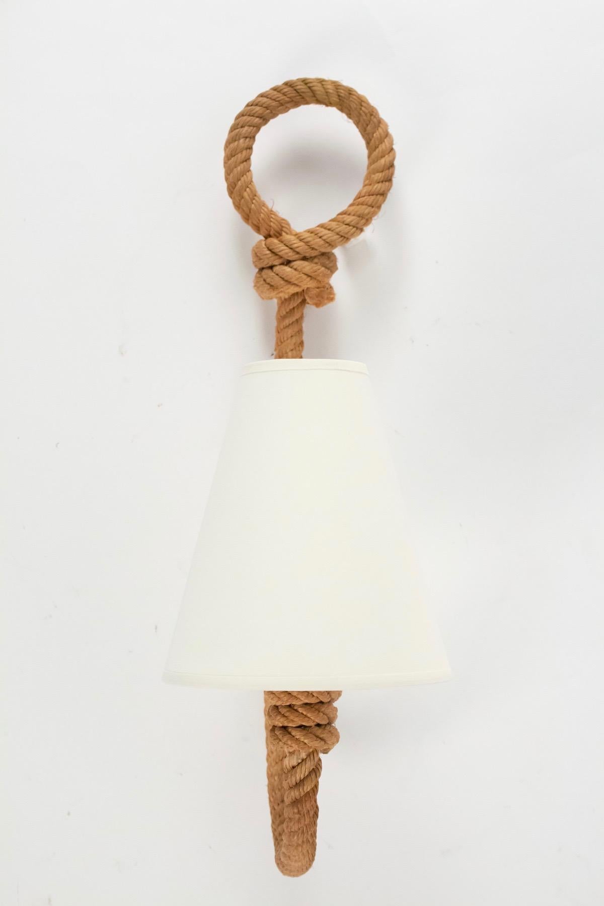 The arms are made of weaved rope ended by a large buckle.
Handmade lampshade in white ivory cotton. 
One bulb per sconce.

Adrien Audoux and Frida Minet are known for their lights and furniture made of rope.
Their first workshop have been