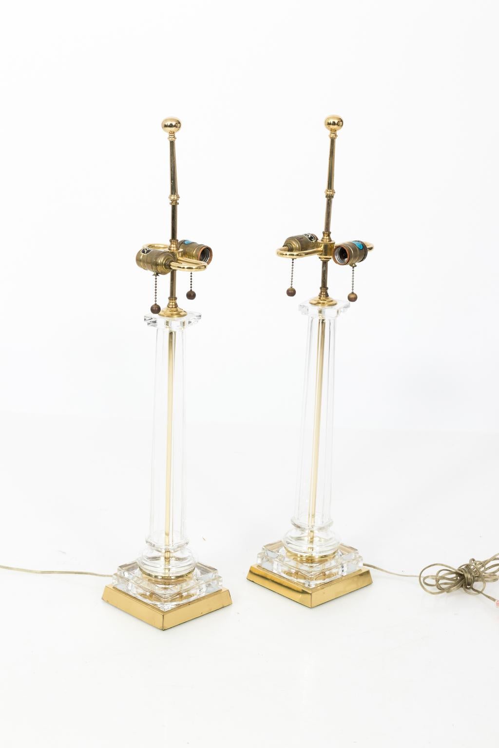 1950s Chapman glass column lamps with brass bases. Shades not included.
     