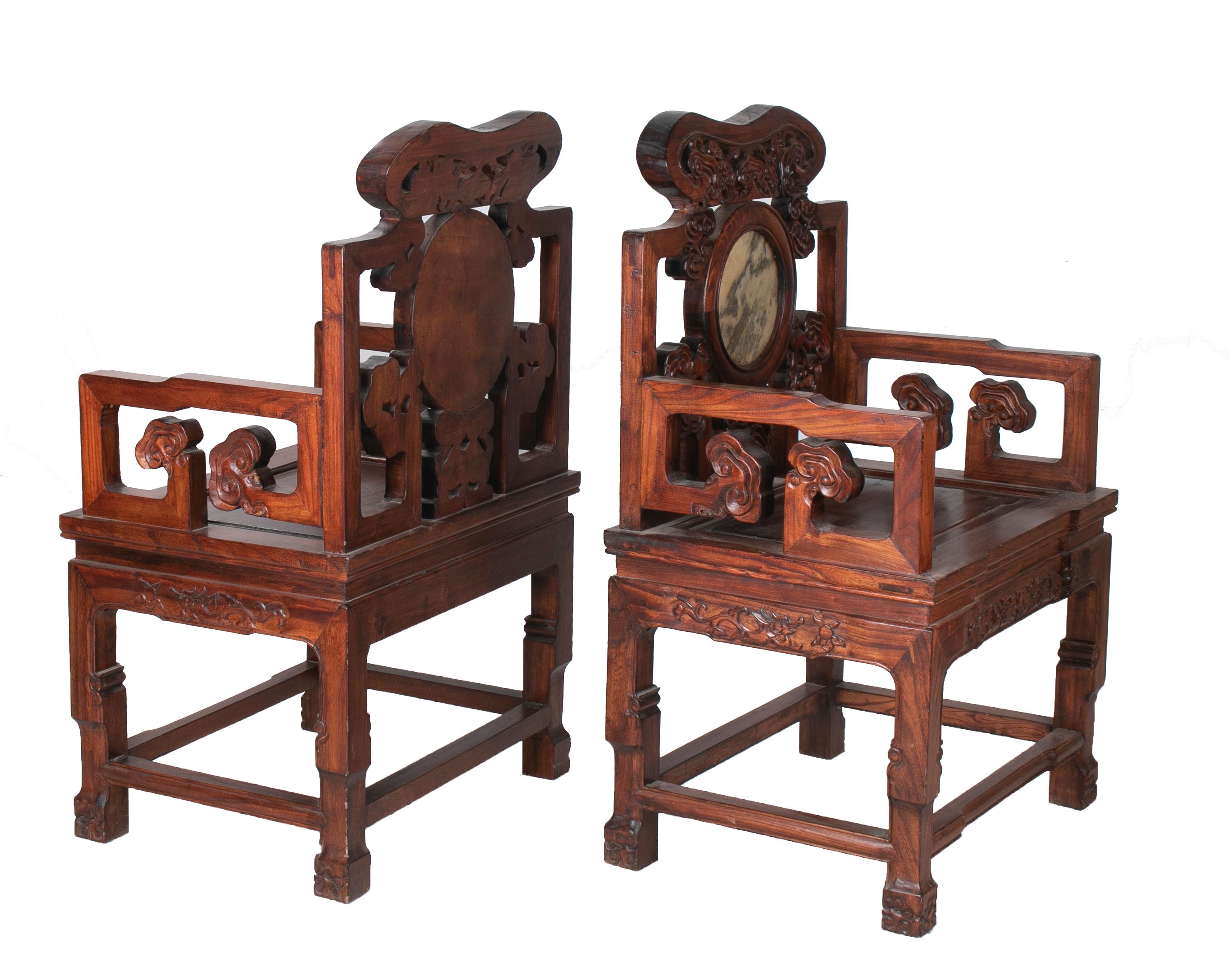 1950s pair of Chinese chairs with inset round stone inlay in backrest.