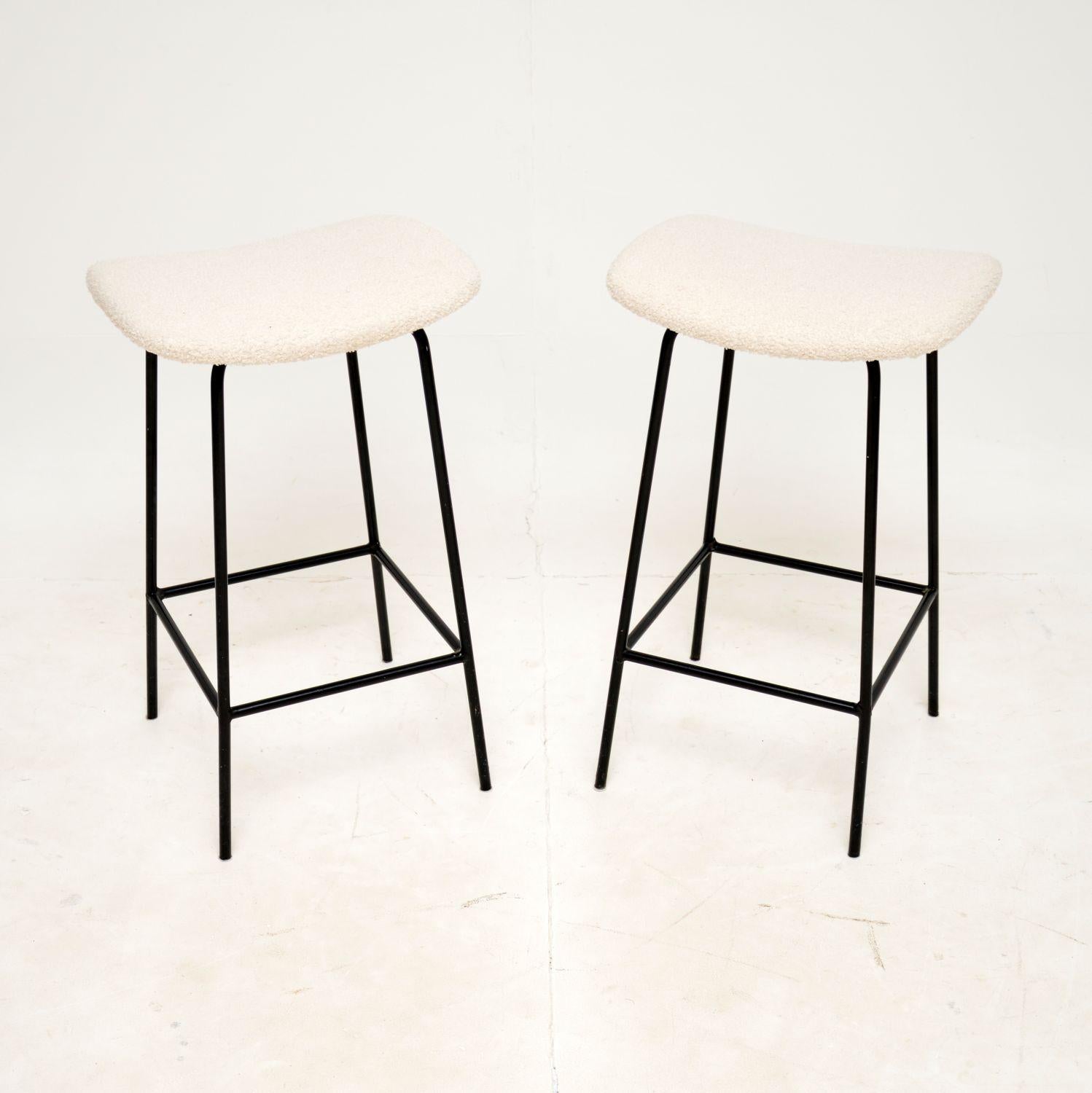 A stylish and iconic design, this pair of stools were designed by Frank Guille for Kandya. They were made in England, and date from around the 1950-60’s.

This model is a less common size than normal, at 61 cm high they are more suited for use at