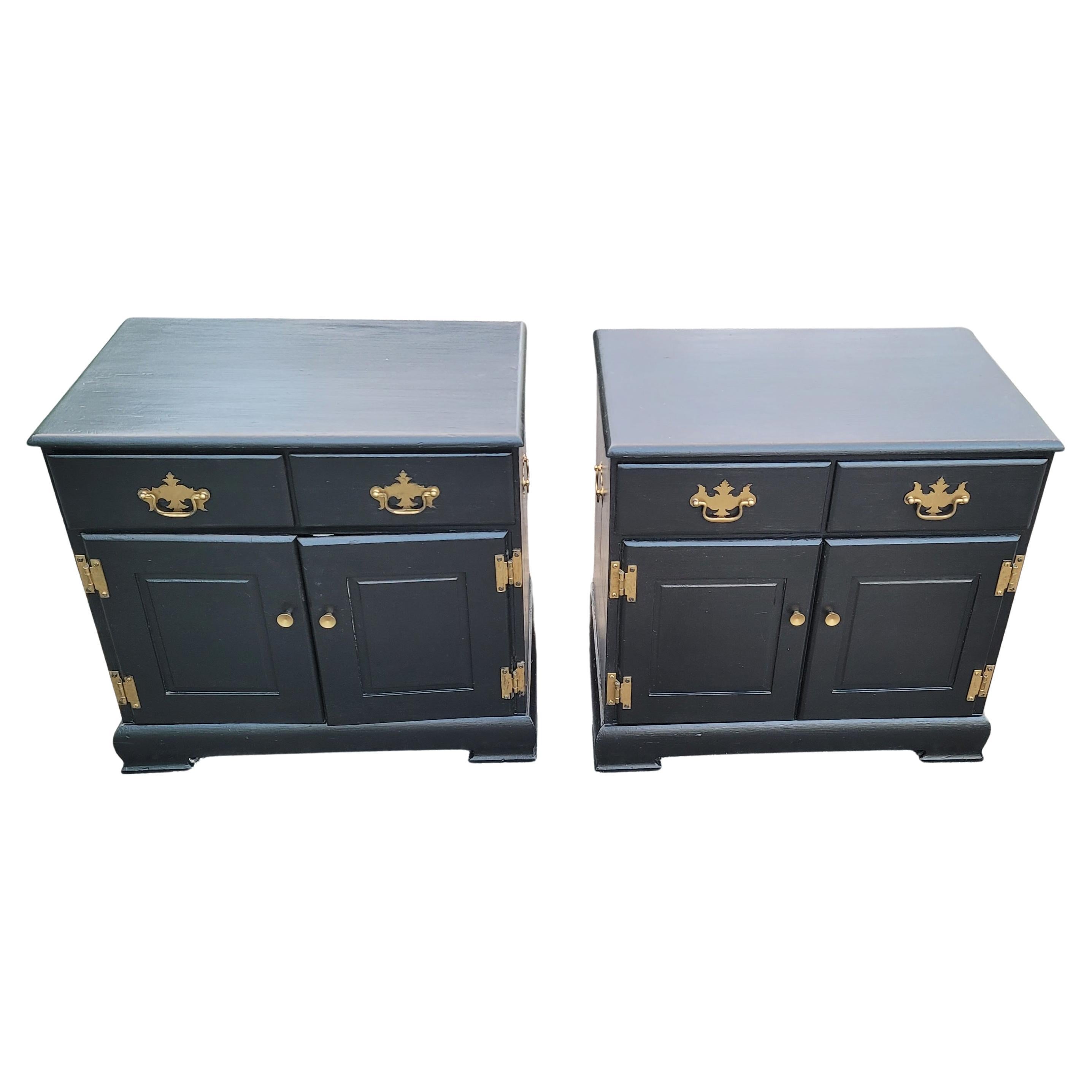 A gorgeous pair of Ebonized French Chippendale side cabinets or nightstands in solid pine in very good vintage condition. Newly ebonized with new solid brass chippendale hardware. Old, Very light weight solid pine wood. Measures 24.25