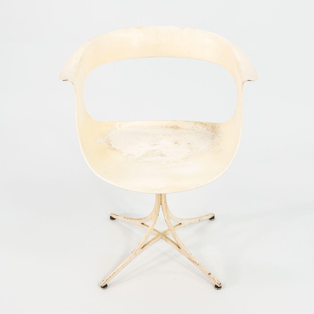 This is a pair of Lotus Chairs, Model 115-LF, designed by Erwine & Estelle Laverne for Laverne International in 1958. The design was part of Laverne‚Äôs Fiberglass Group. The listed price includes the pair. The chairs feature molded fiberglass