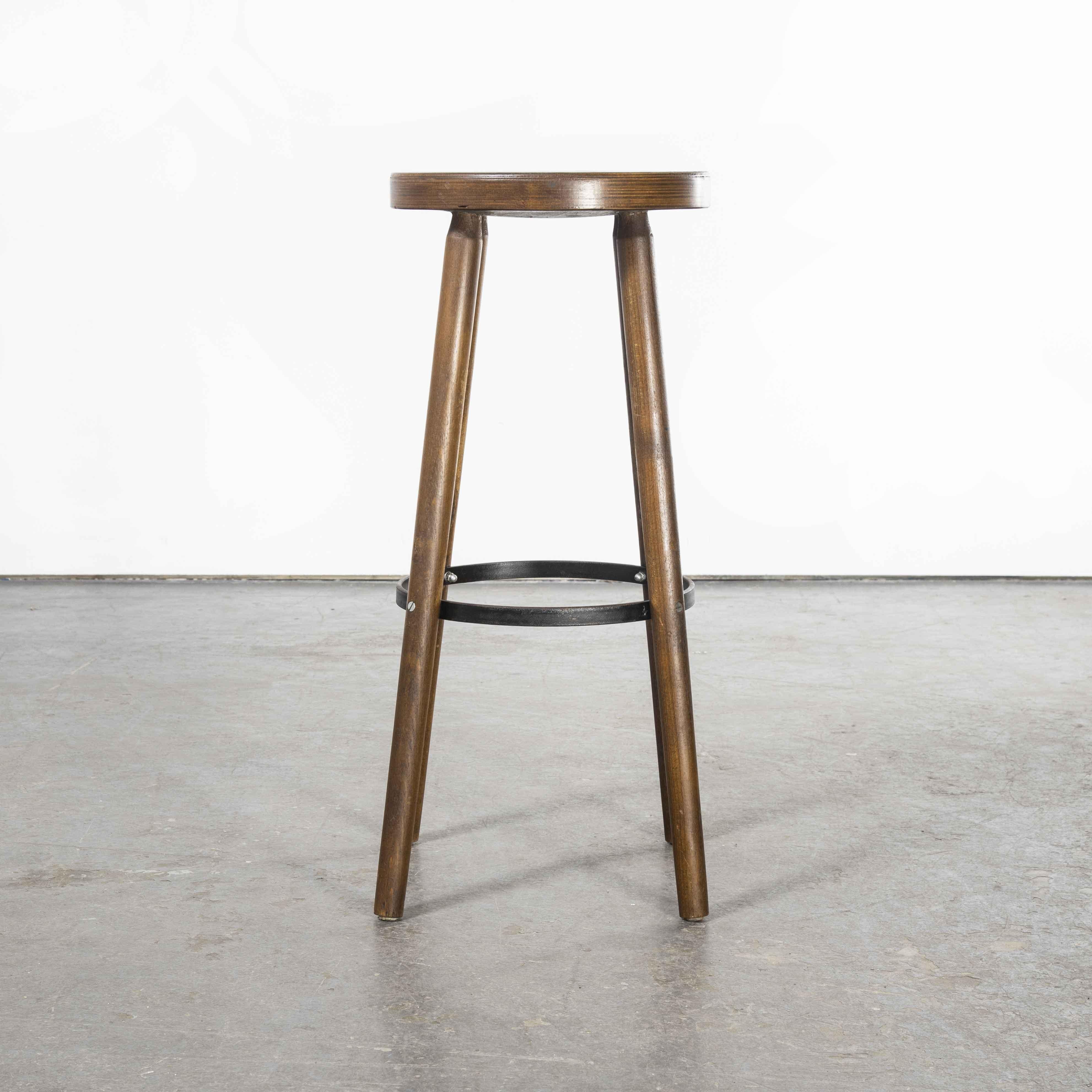 1950’s Set of Five French Simple Walnut Bar Stools

1950’s Pair of French Simple Walnut Bar Stools. Good honest pair of interesting French bar stools. The legs have a straight through with metal ring supports. Seat height 78cm, birch with a rich