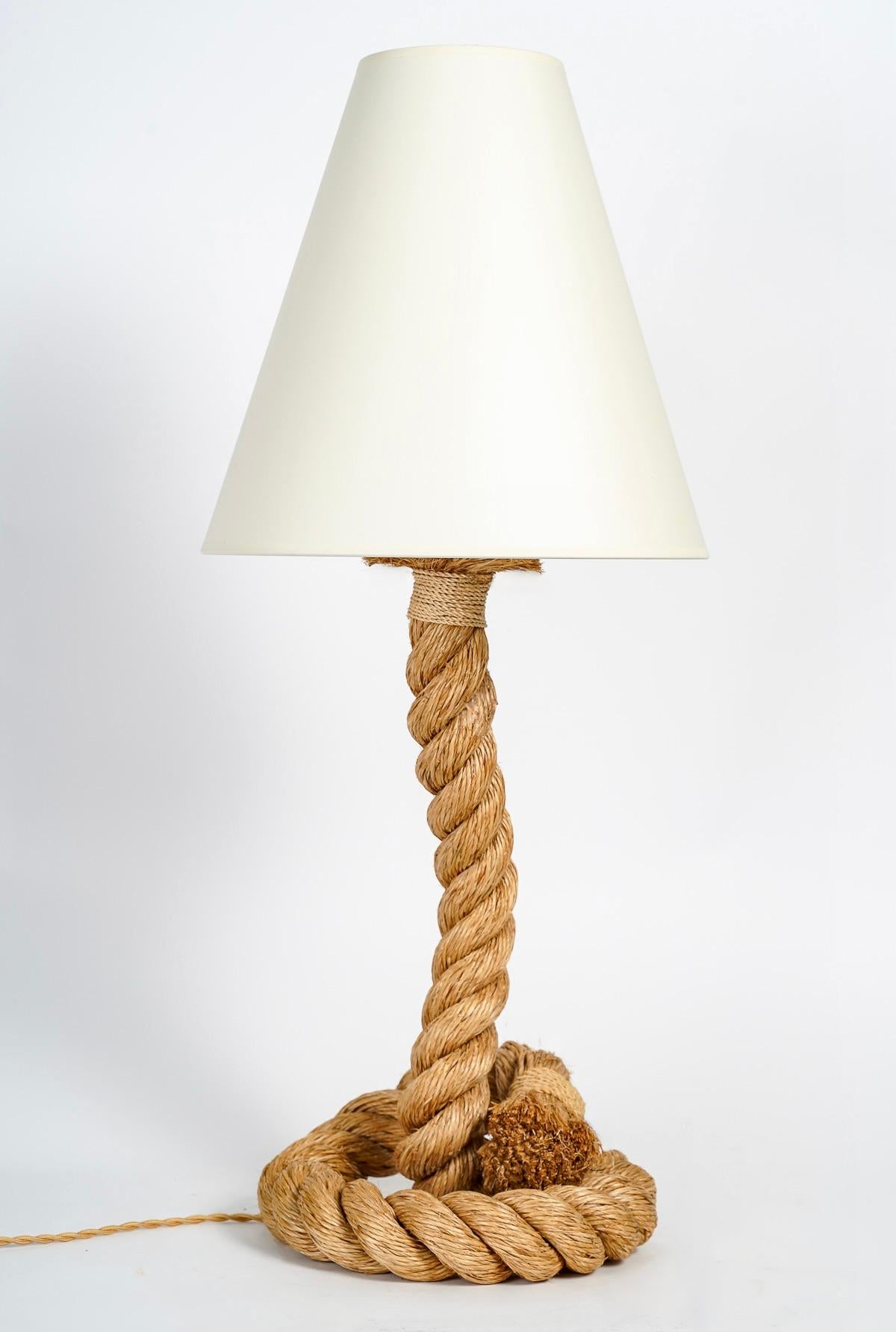 Rare pair of large rope lamps by Audoux and Minet from the 1950's
The twisted rope lamp base is nicely coiled to form the base, then it comes up and becomes the light arm, all made with one piece of rope.
The light arm is dressed on the upper part