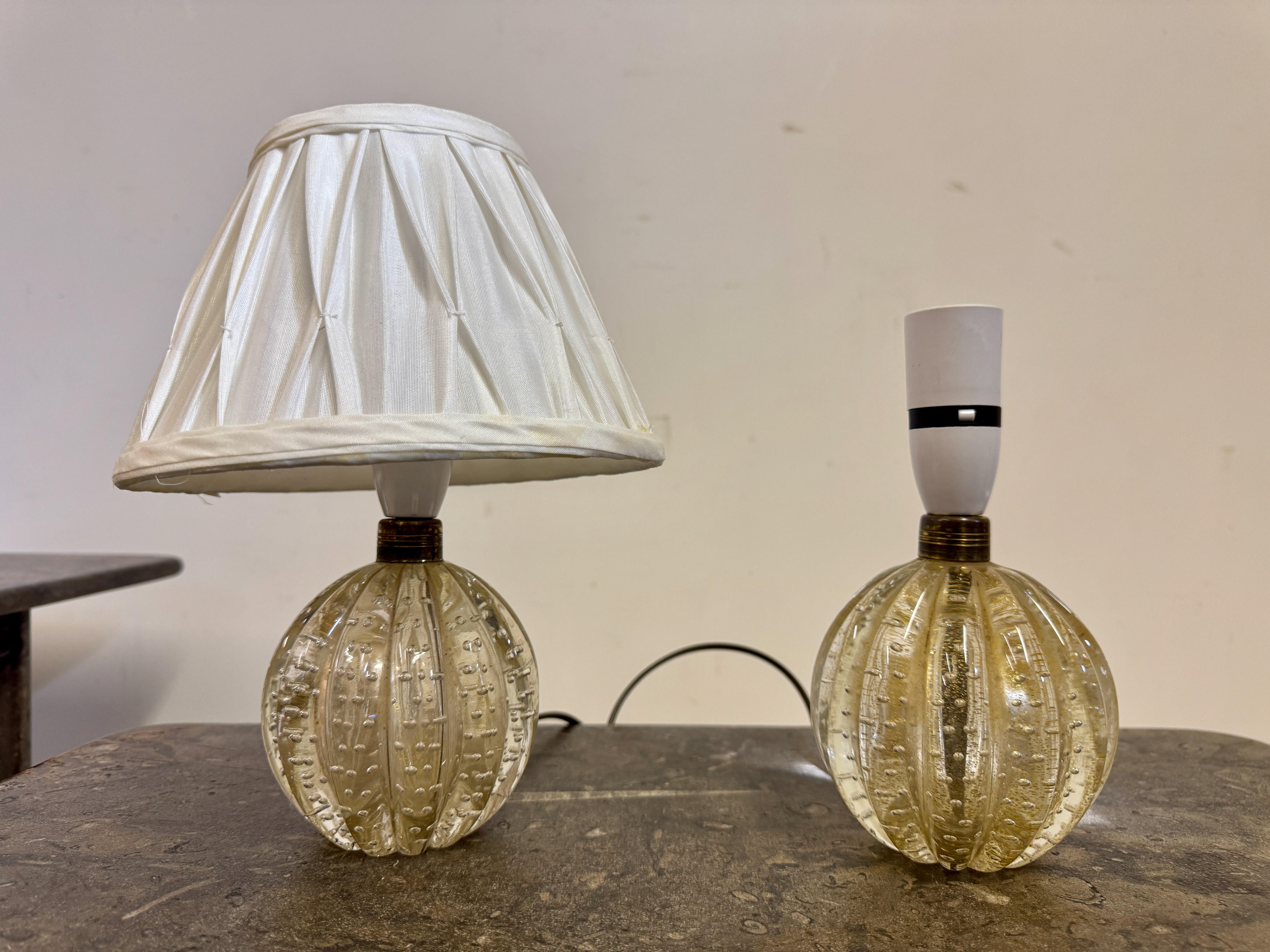 Pair of Murano Bullicante table lamps.

A pair of Murano glass table lamps, featuring a striking 
