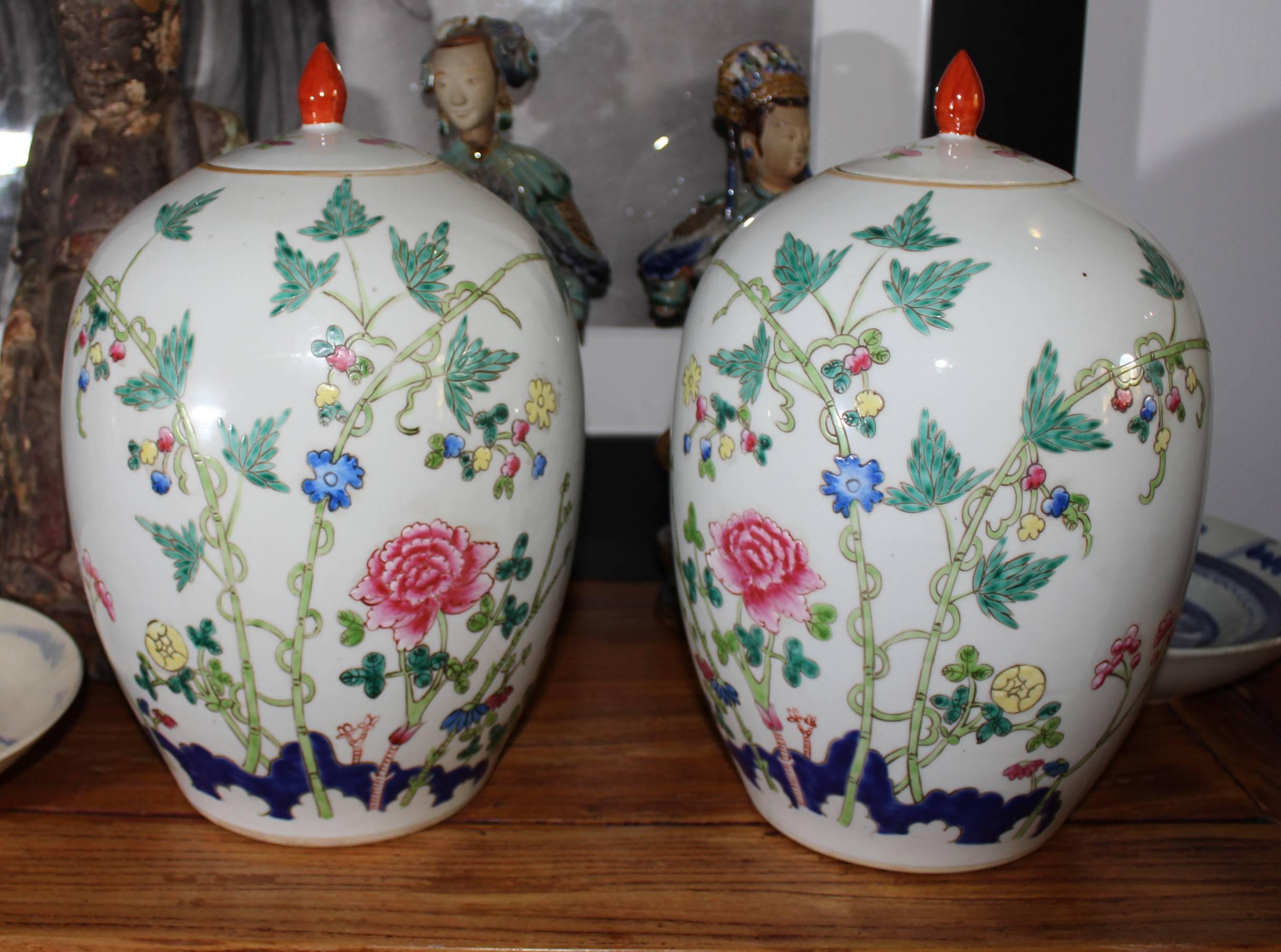 1950s Pair of oriental urns with flower decorations.