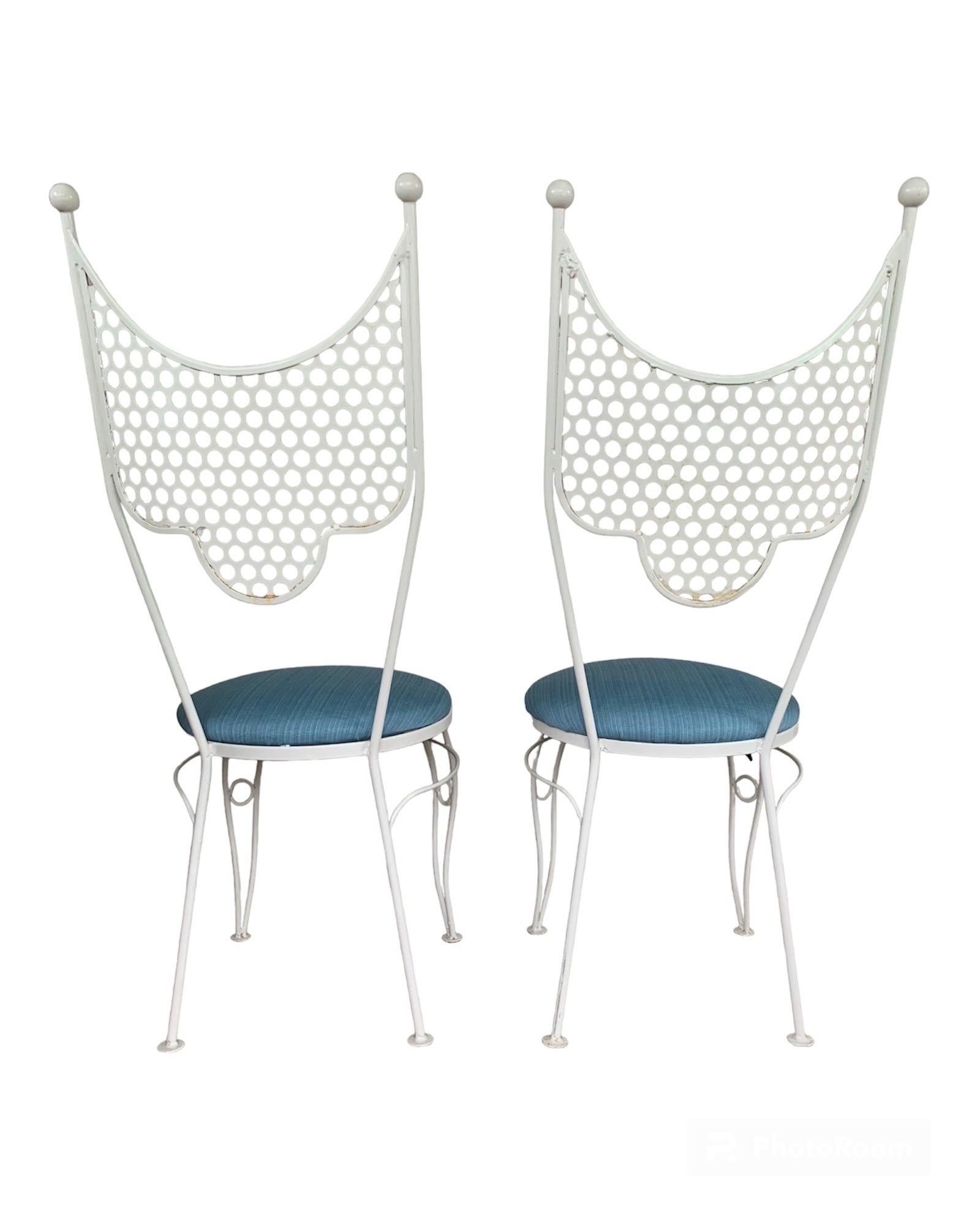 This is a pair of white enameled-iron chairs from Salterini’s “Circus” Collection, ca. mid-1950s. They are in very good condition, having been recently refinished. They have been freshly reupholstered in a thick blue striated fabric and are ready