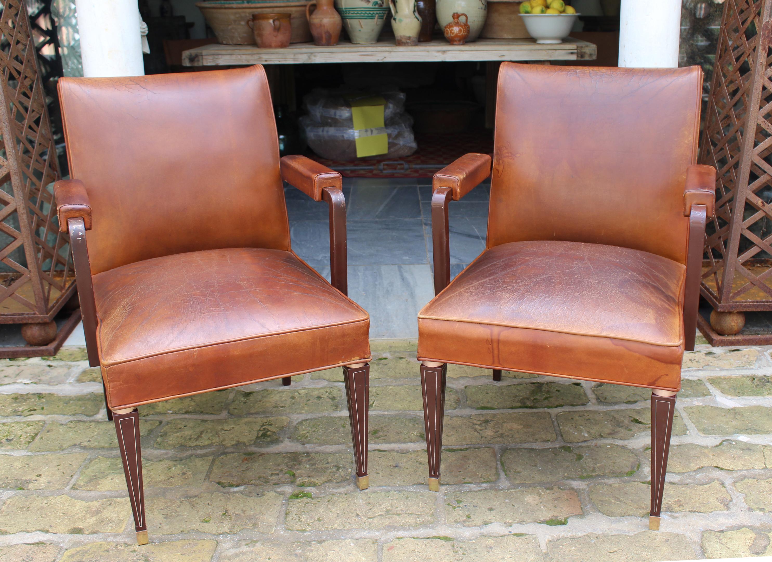1950s pair of Spanish brown leather and brass fittings classical arm chairs, made by Sistemas 
