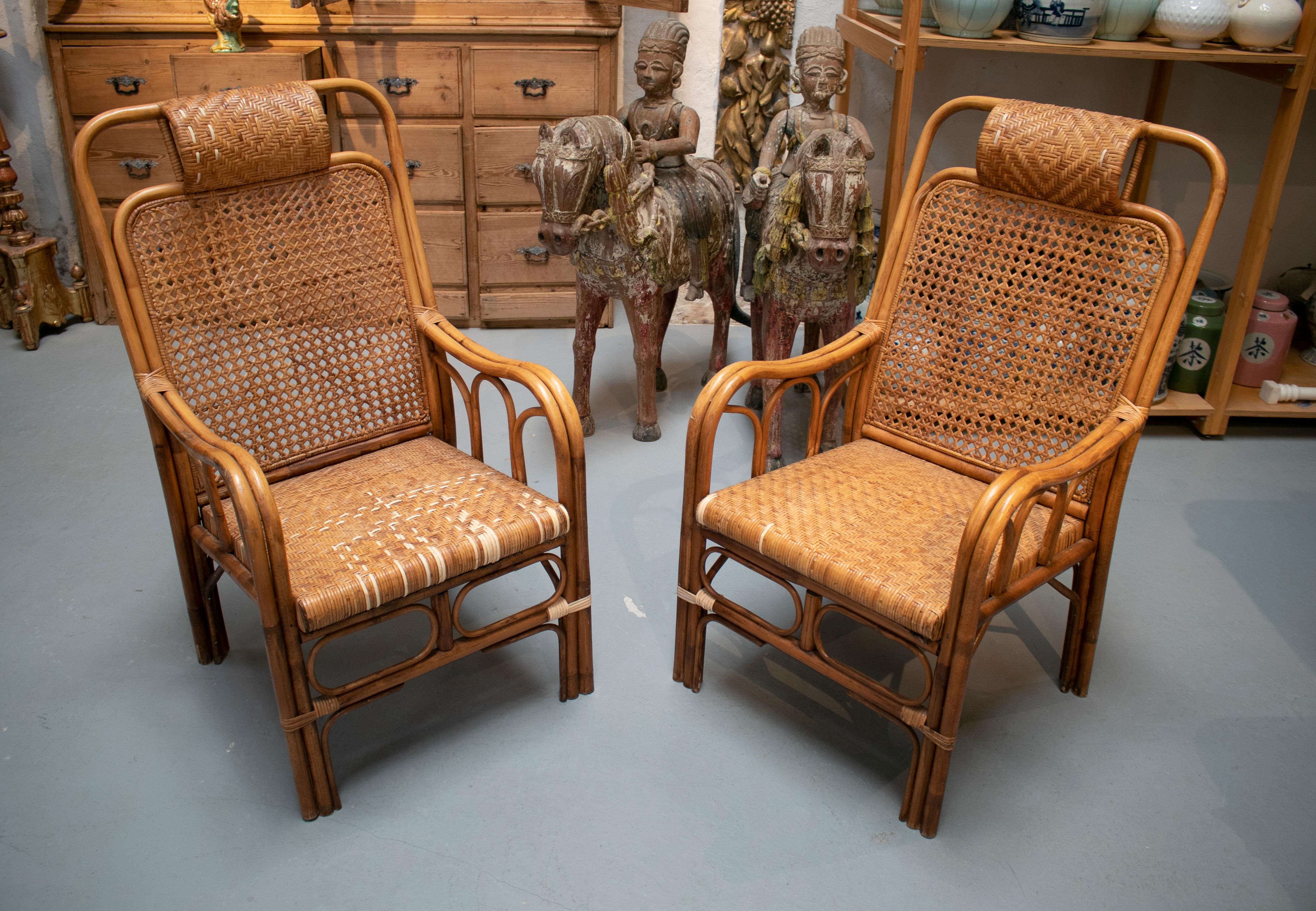 Vintage 1950s pair of Spanish hand woven wicker armchairs.