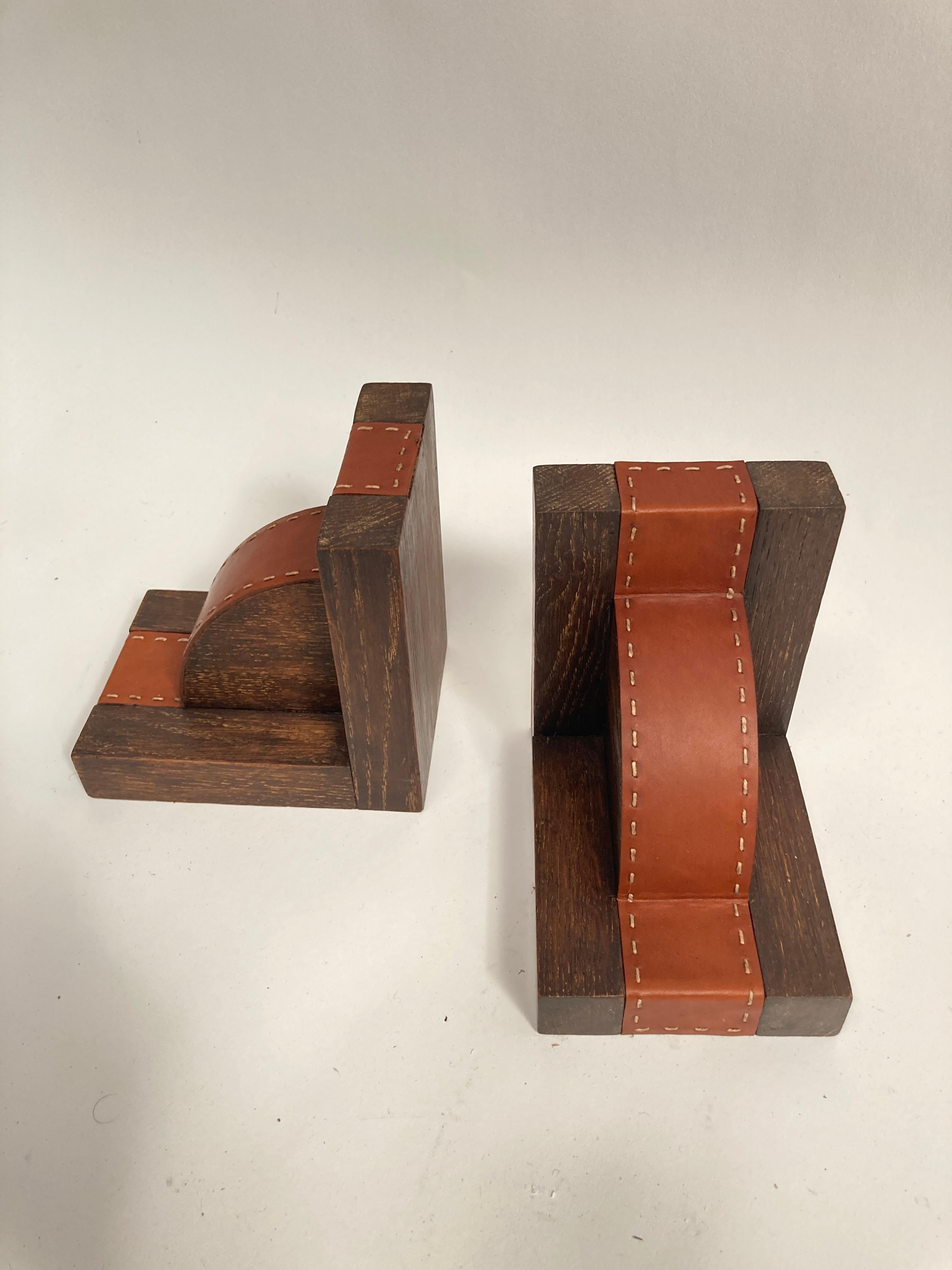 French 1950's Pair of stitched Leather book end by Jacques Adnet For Sale