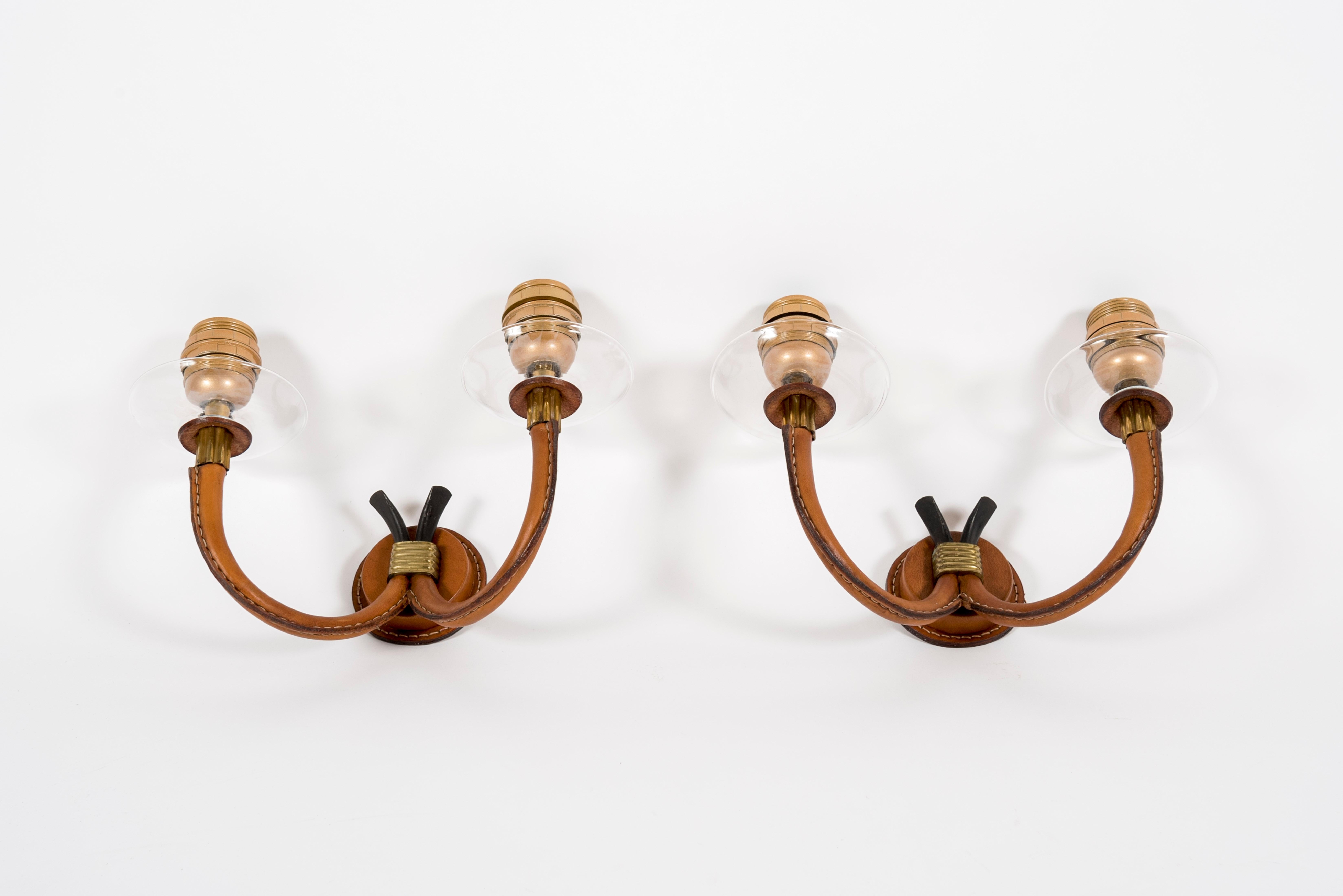 1950's pair of stitched leather sconces by Jacques Adnet
France.