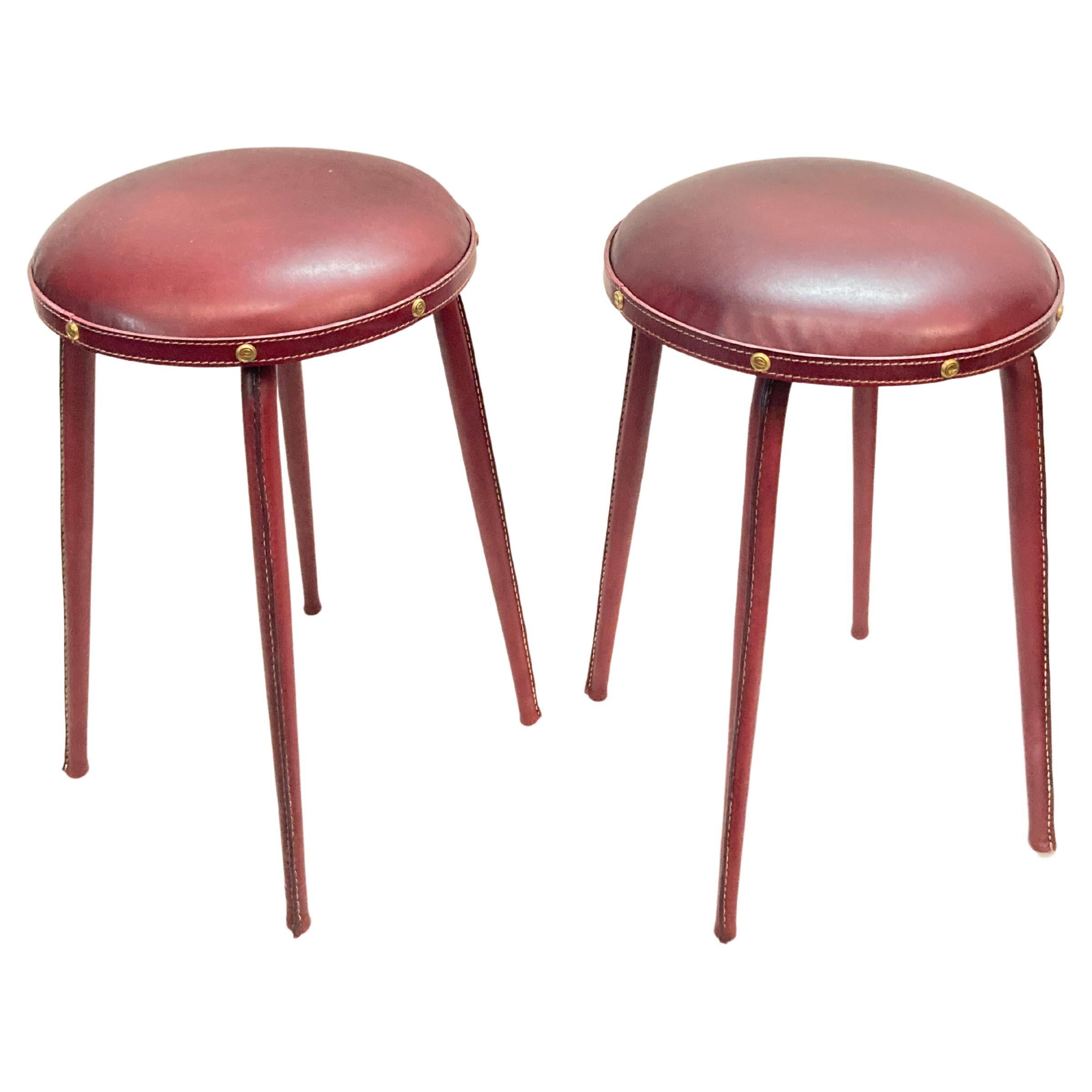 1950's pair of stitched leather stools by Jacques Adnet For Sale