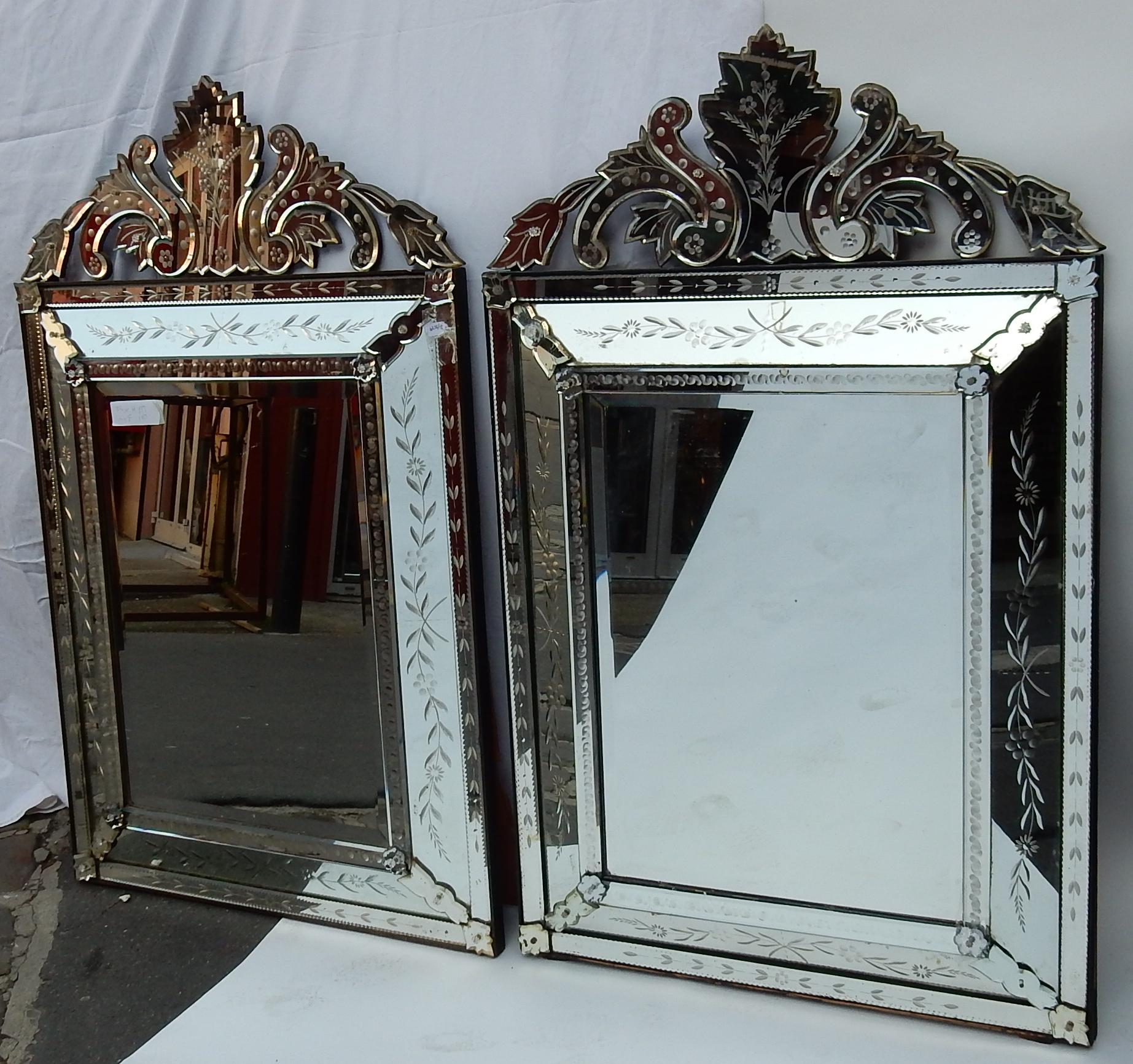 1950s pair of Venetian mirrors with floral decor and pediment. Good condition.