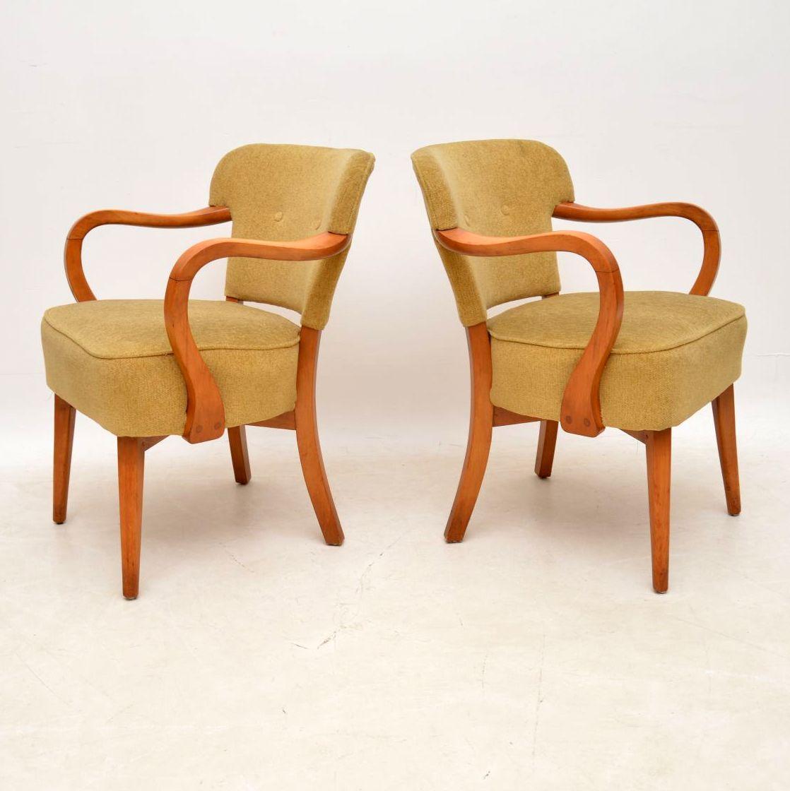 A beautifully designed pair of vintage cocktail chairs, these date from the 1950’s. They are in superb condition for their age, having been recently re-upholstered by the previous owner. The solid wood frames are clean, sturdy and sound, with only