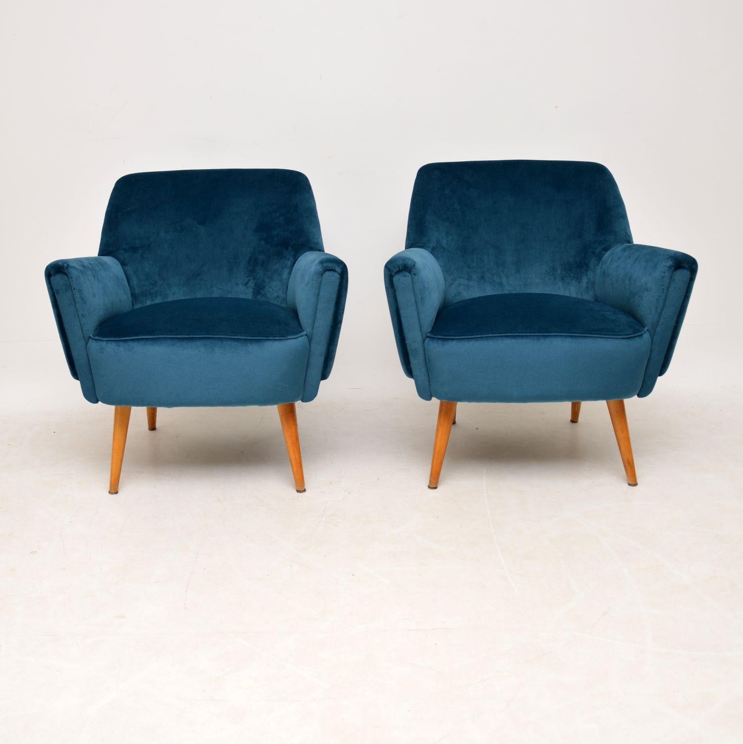 A stunning, top quality pair of vintage cocktail armchairs dating from the 1950s-1960s. Not to be confused with the many cheap, modern imitations available on the market! They have a beautiful shape and design, we have had these newly upholstered in