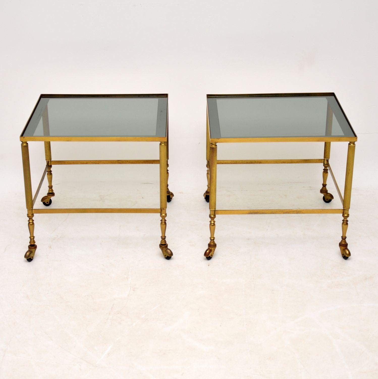 A beautifully made and very stylish pair of vintage brass side tables with glass tops, these were made in France and date from the 1950s-1960s. They are a great size and are in lovely vintage condition, with just the right amount of wear and patina