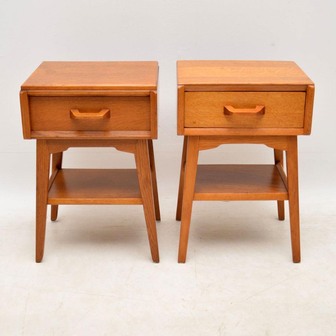 A stylish and very practical pair of vintage bedside tables in oak, made by G- Plan as part of the Brandon range in the 1950s. One of these tables is original, the other seems to have been made by someone to match the other. Considering this was