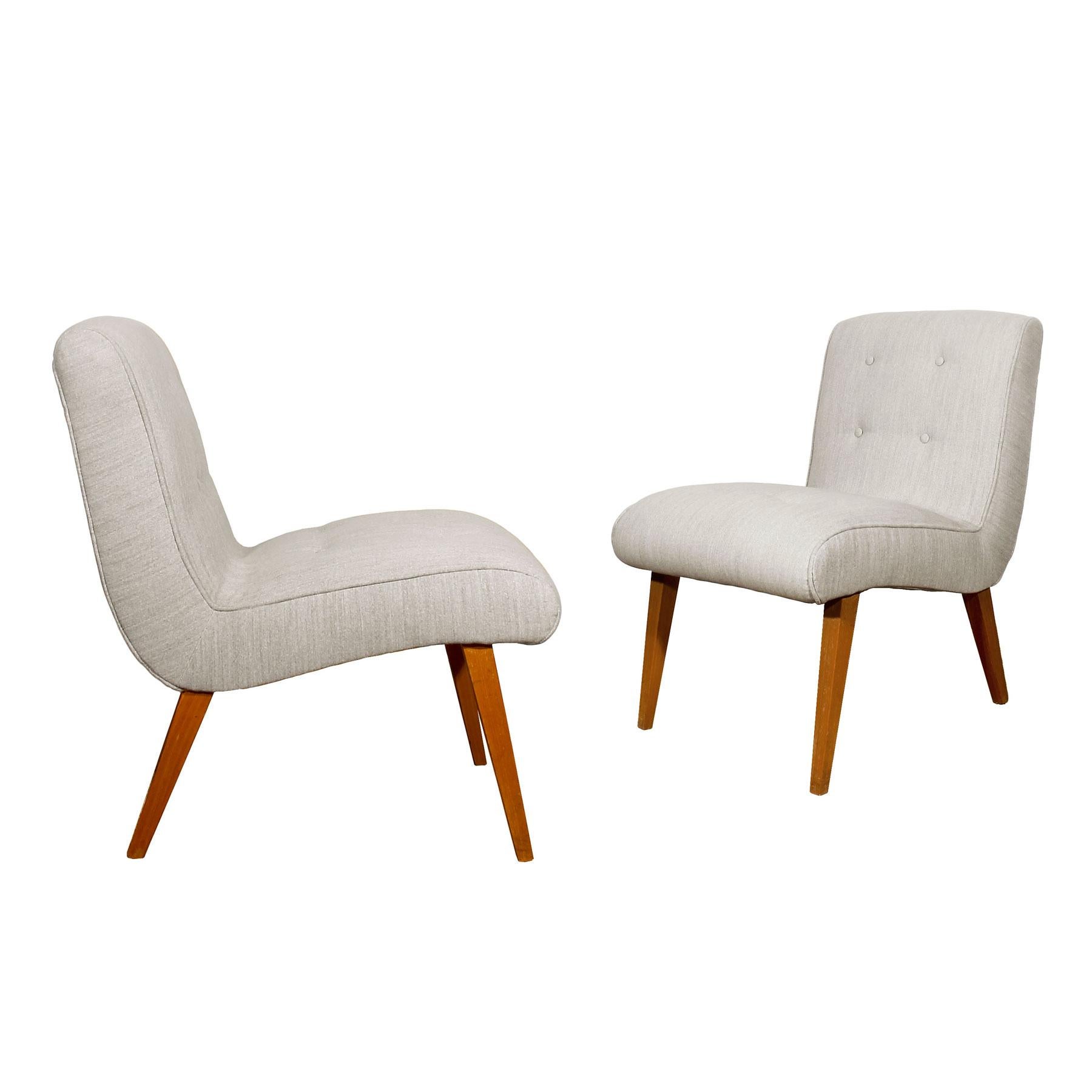 Pair of Vostra low chairs, new upholstery, button padding grey felt, beechwood feet, French polish.

Model: Vostra.

Design: Walter Knoll Team.

Manufacturer: Walter Knoll.

Germany, circa 1950.