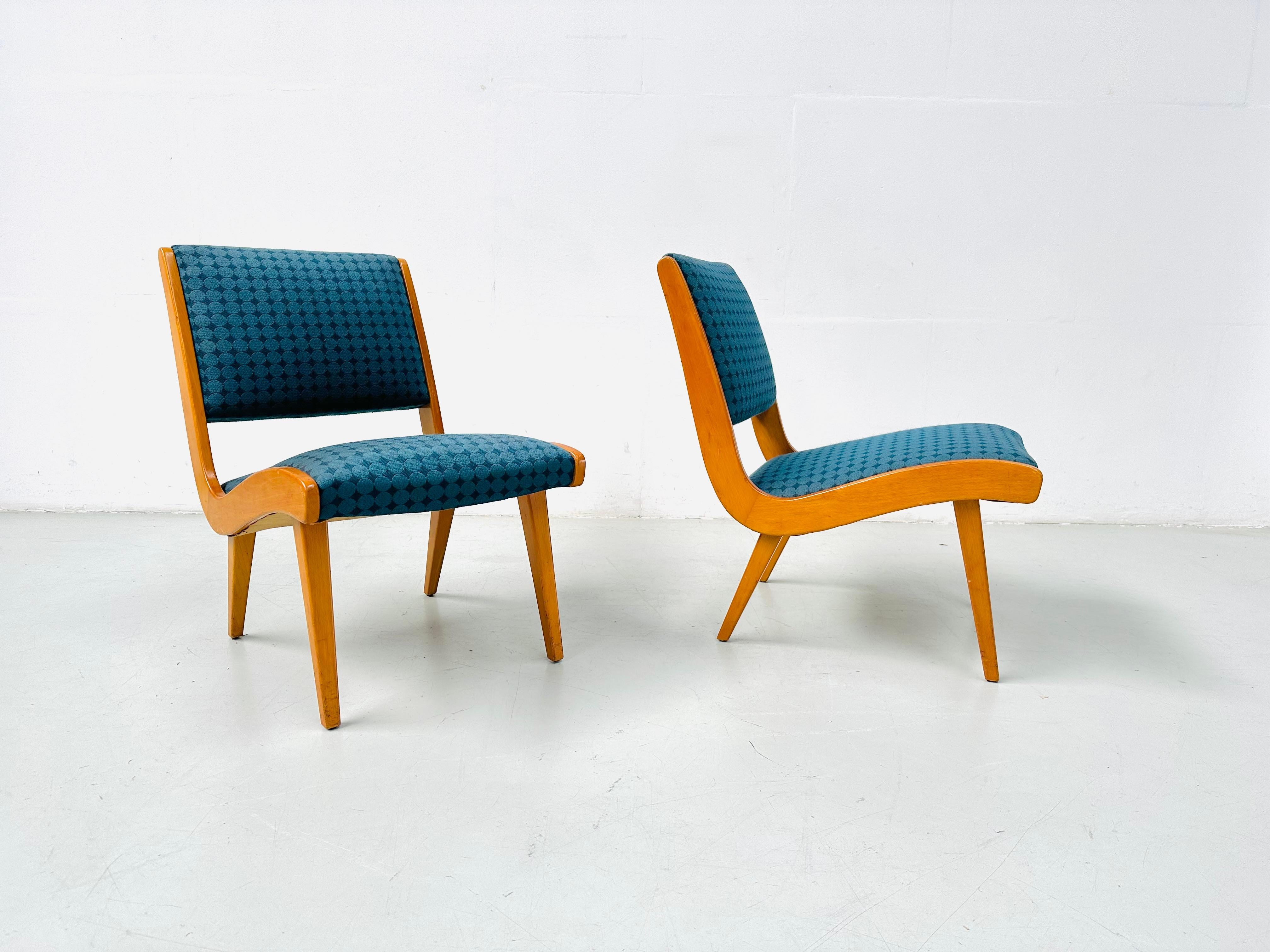 These rare “Vostra” easy chairs were designed by Jens Risom in 1941. These chairs are numbered in the frame. This is chair number 1247 and number 1248. The chairs are in good condtion. The original fabric is still on the chairs. 

The Vostra chair