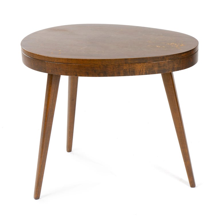 Pair of walnut side tables with thick, irregularly shaped tops set on three solid walnut angled legs.