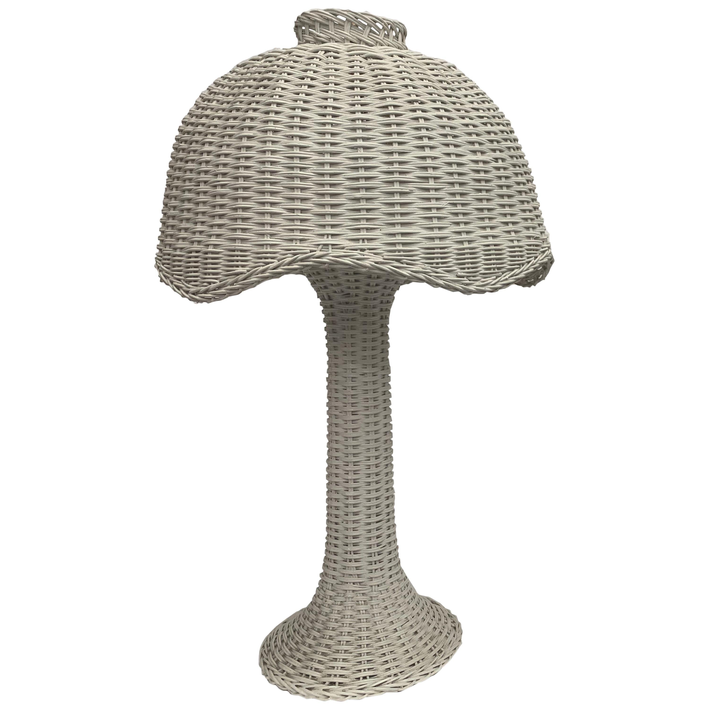 A pair of white wicker lamps with matching scalloped edged shades. 

Property from esteemed interior designer Juan Montoya. Juan Montoya is one of the most acclaimed and prolific interior designers in the world today. Juan Montoya was born and spent