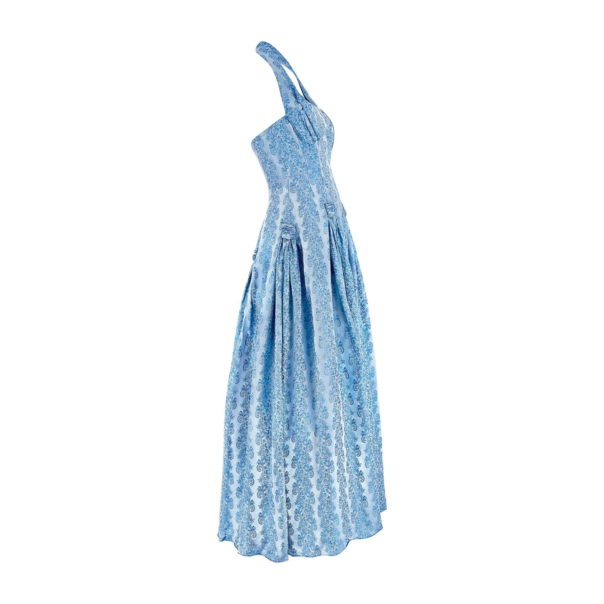 1950s blue jacquard full length evening dress. Beautifully made with good technique and classic construction details in a fine, high quality fabric which catches the light. It has an elaborately built corseted bodice with gentle pleating over the