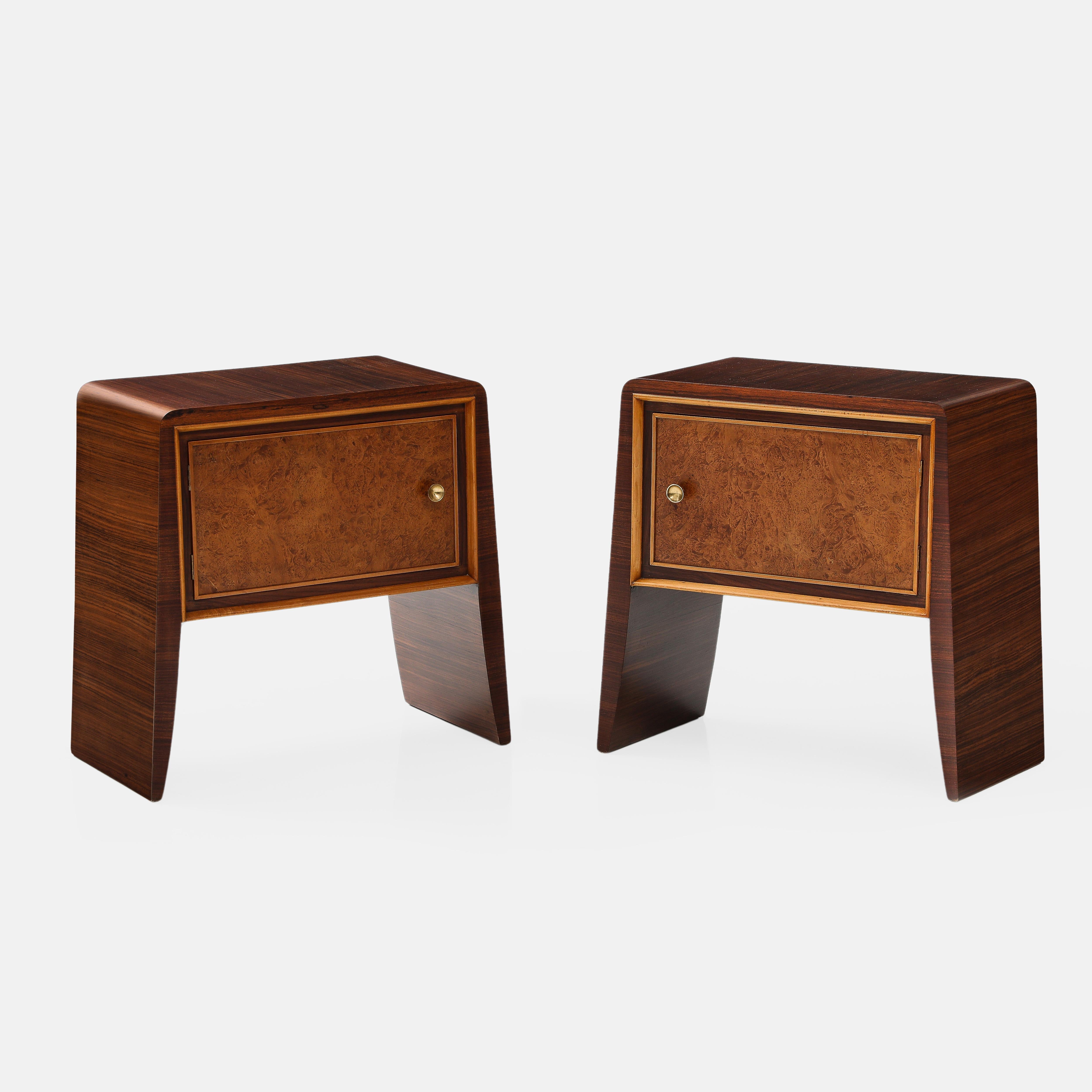 1950s pair of waterfall nightstands or bedside tables in rosewood and birchwood each with one door cabinet and brass knob, attributed to Paolo Buffa. These elegant end tables have lovely curved corners with draping sides that cascade and slightly