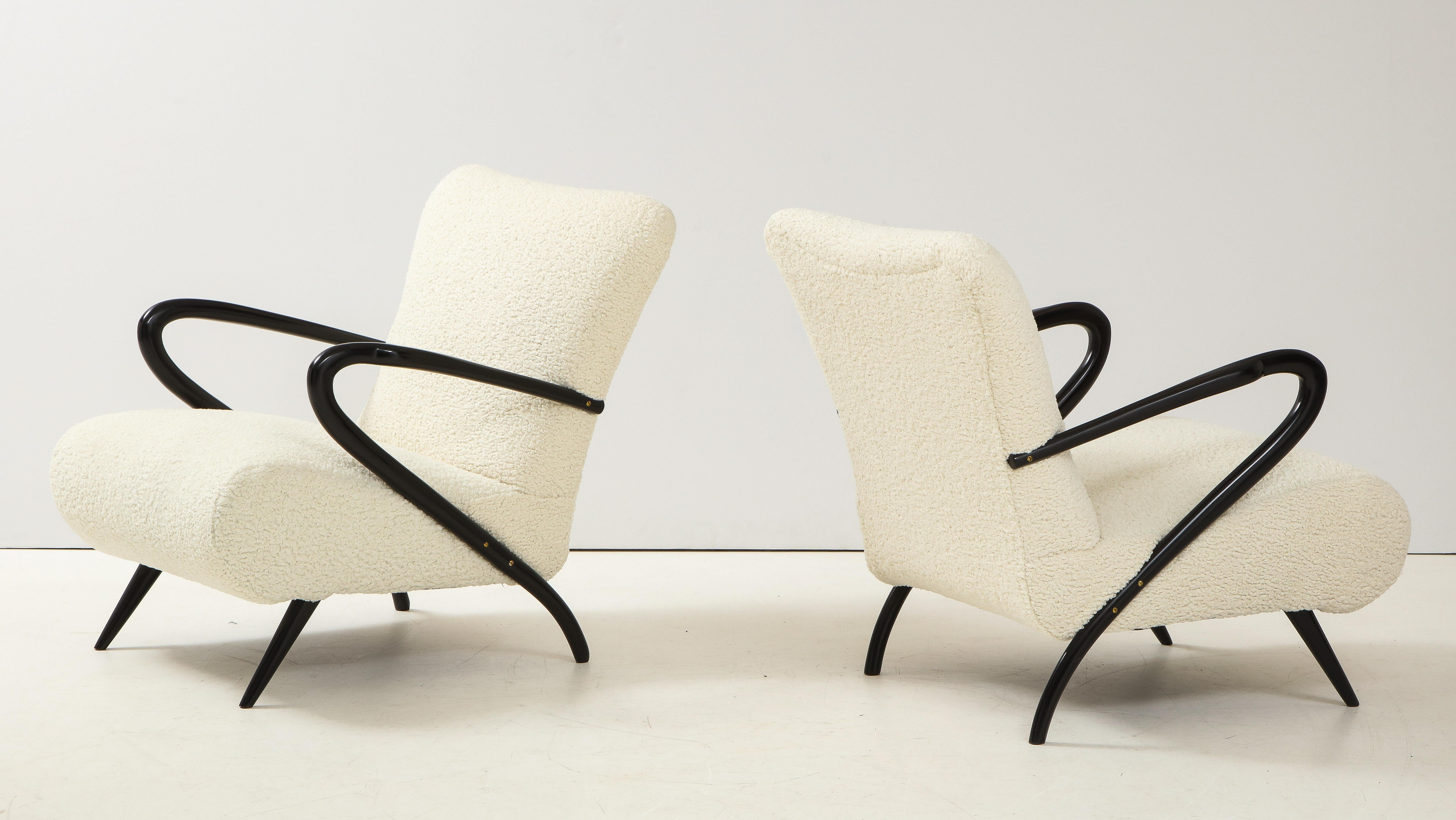 Stunning pair of 1950's sculptural lounge chairs designed by Paolo Buffa, fully restored and re-upholstered in Boublè fabric.