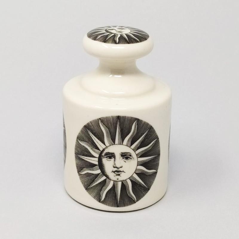 1950s Astonishing rare porcelain paperweight by Piero Fornasetti with an amazing sun motif. Heavy porcelain construction for use as beautiful desk accessories. This item is in very good condition. It's signed at the bottom. This paperweight is a