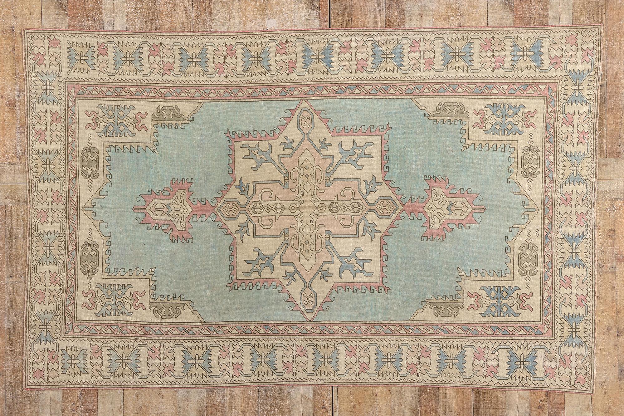 53992 Vintage Turkish Oushak Rug, 05'10 x 09'01. Woven in the ancestral heartland of Anatolia, this hand knotted wool vintage Turkish Oushak rug reveals a quiet strength and a sacred geometry drawn from centuries of cultural memory. At its center, a