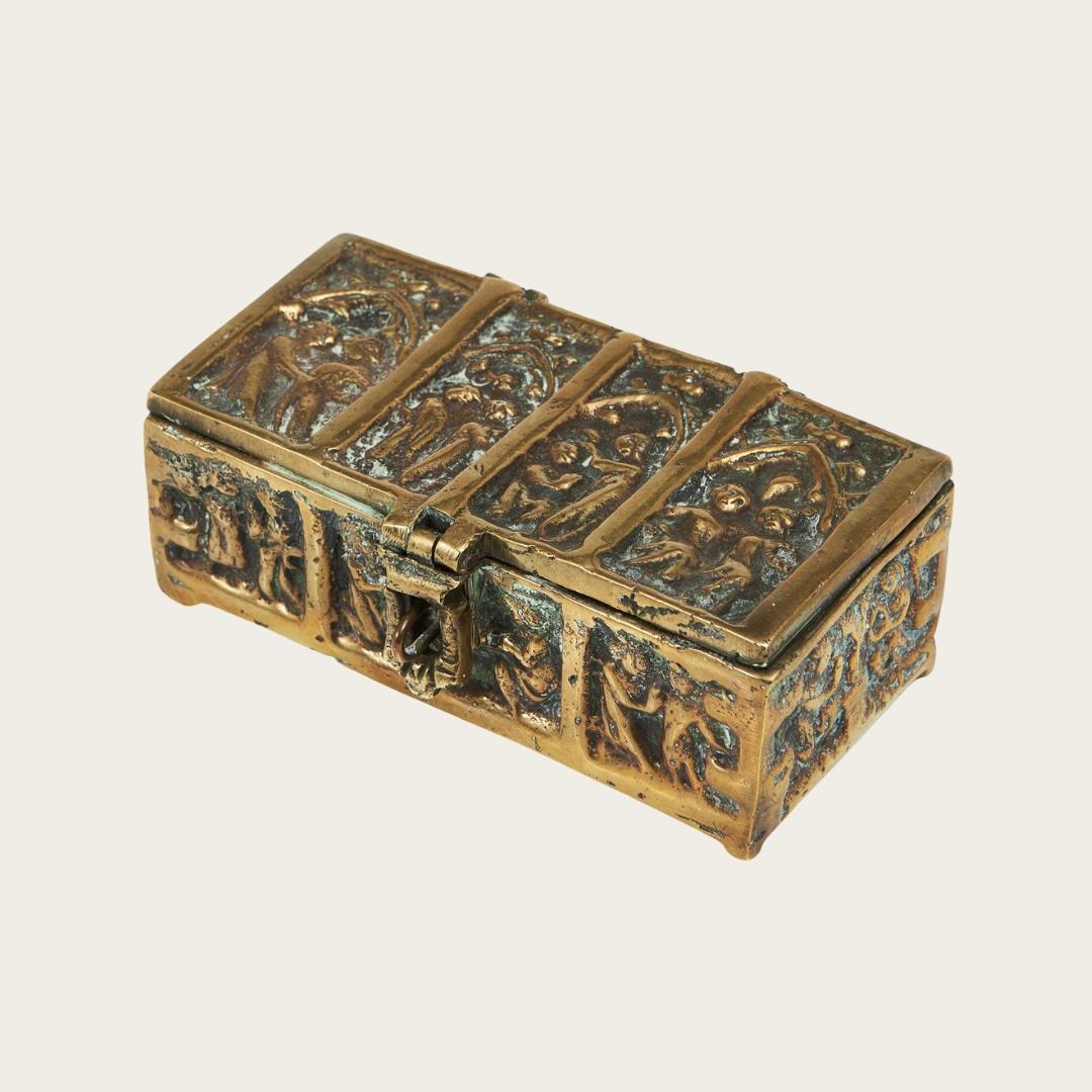 1950s, Sweden. Unmarked, designer unknown. Solid brass abstract relief of two people falling in love on the cover. Relief scenes show depictions of getting down on one knee and a wedding ceremony. The box has natural patination and oxidation