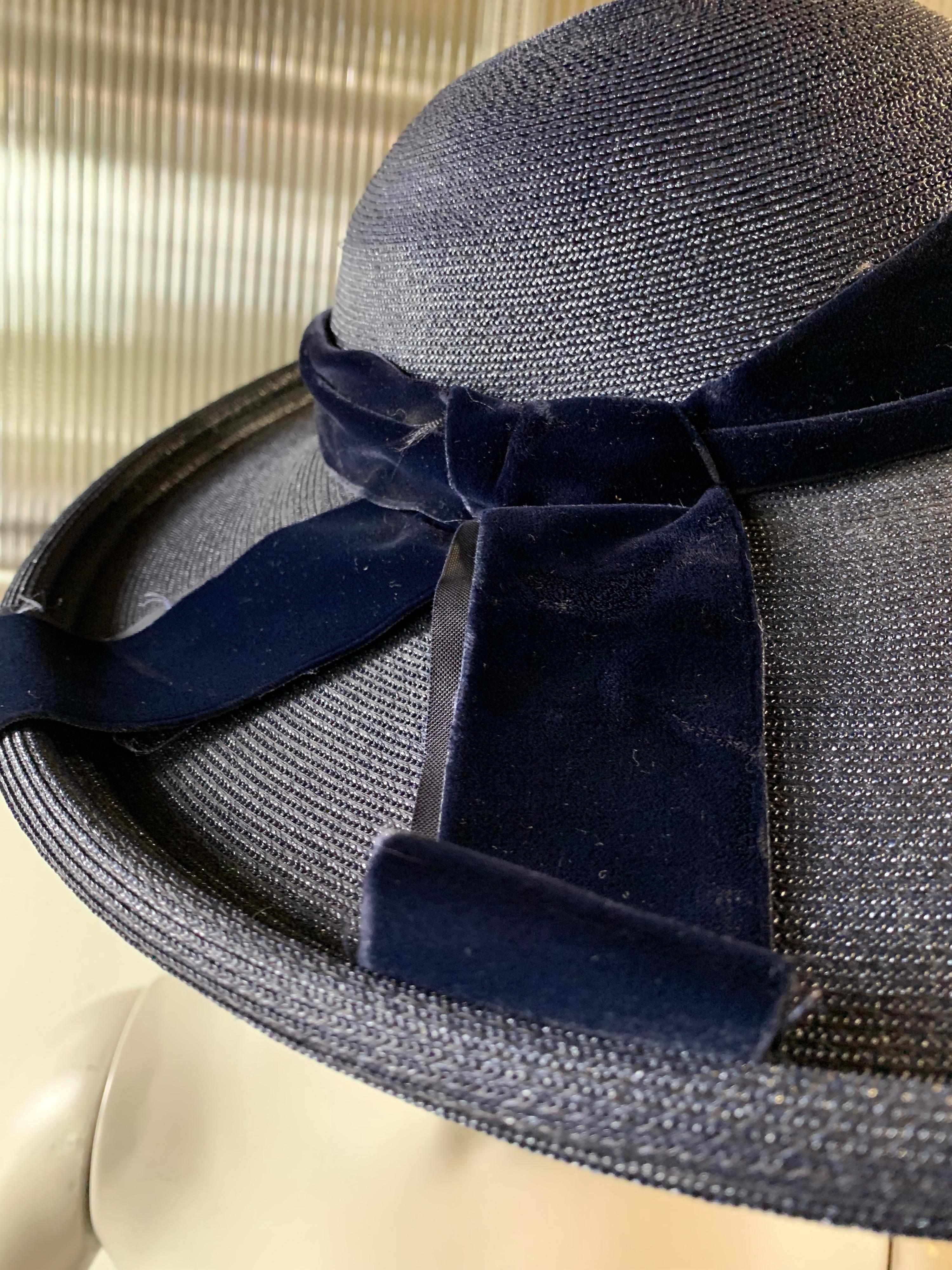 1950s Patrice Model Large-Brimmed Navy Blue Straw Cartwheel Hat W/ Double-Layered Brim. A gorgeous finely woven straw, rolled at the edge. A lovely silk velvet band to match. Size 22.