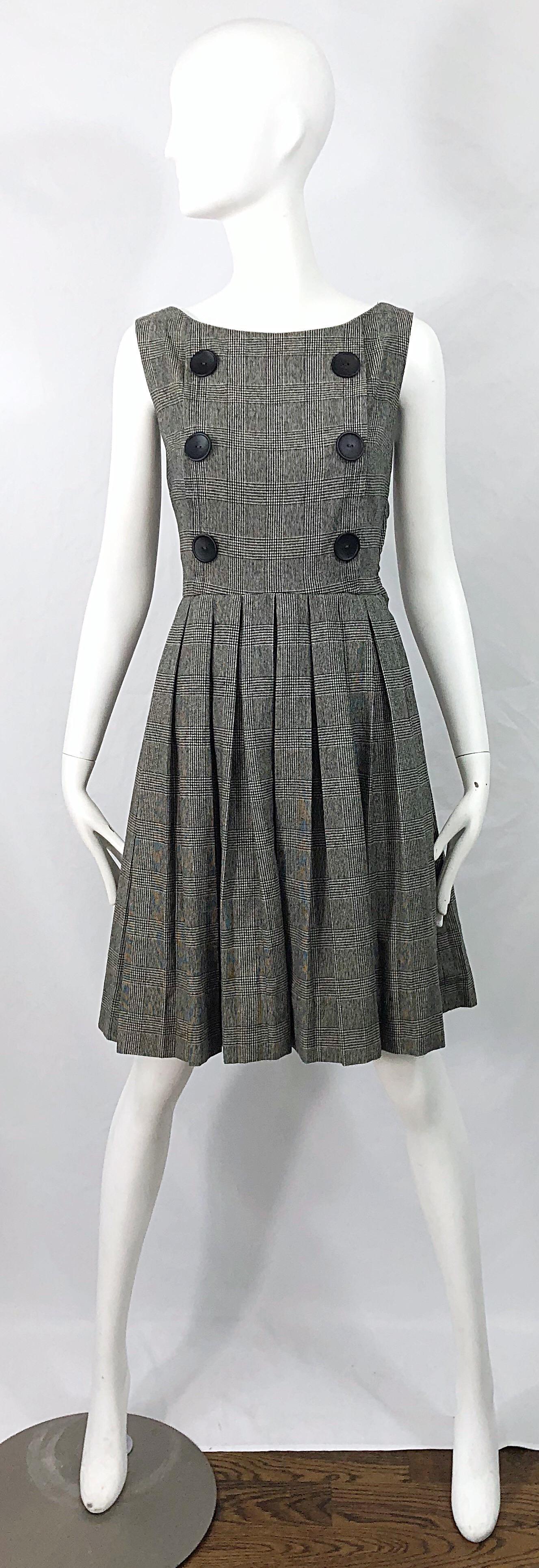 Chic and timeless 1950s PATTY WOODARD black and white mini houndstooth plaid print fit n' flare vintage dress ! Features a tailored bodice with six large buttons on the front. Full pleated skirt that can also accomodate a crinoline for extra