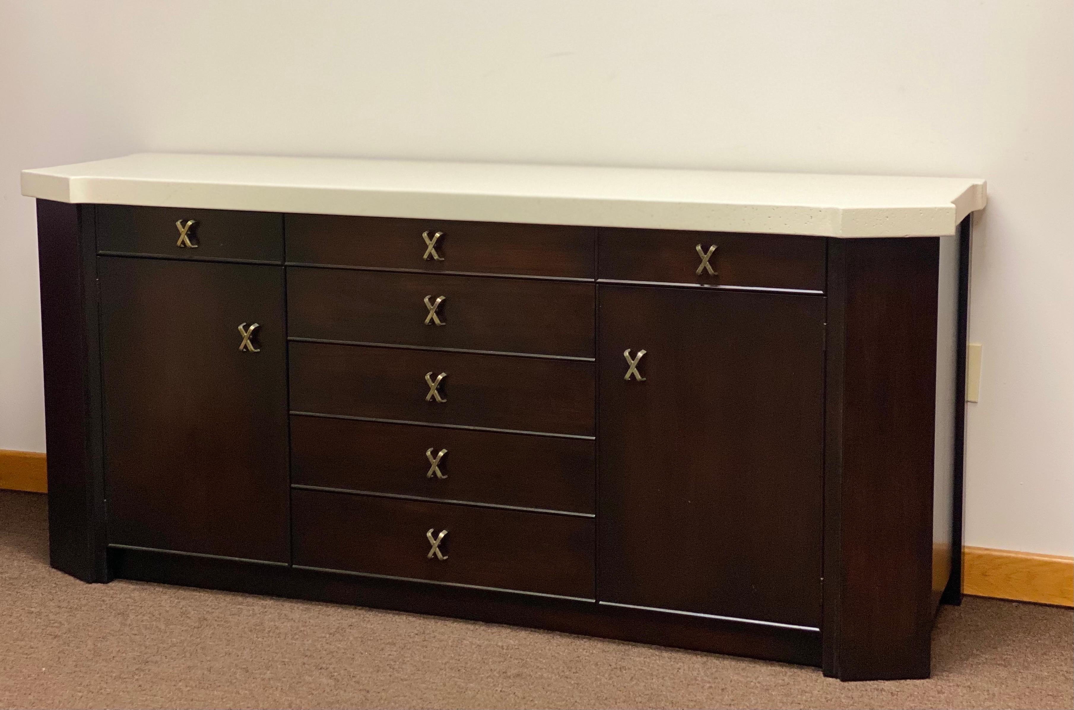 We are very pleased to offer a timeless credenza designed by Paul Frankl for The Johnson Furniture Company, circa the 1950s. Back in the day, Johnson company in Grand Rapids, Michigan was one of the largest furniture companies in the United States.