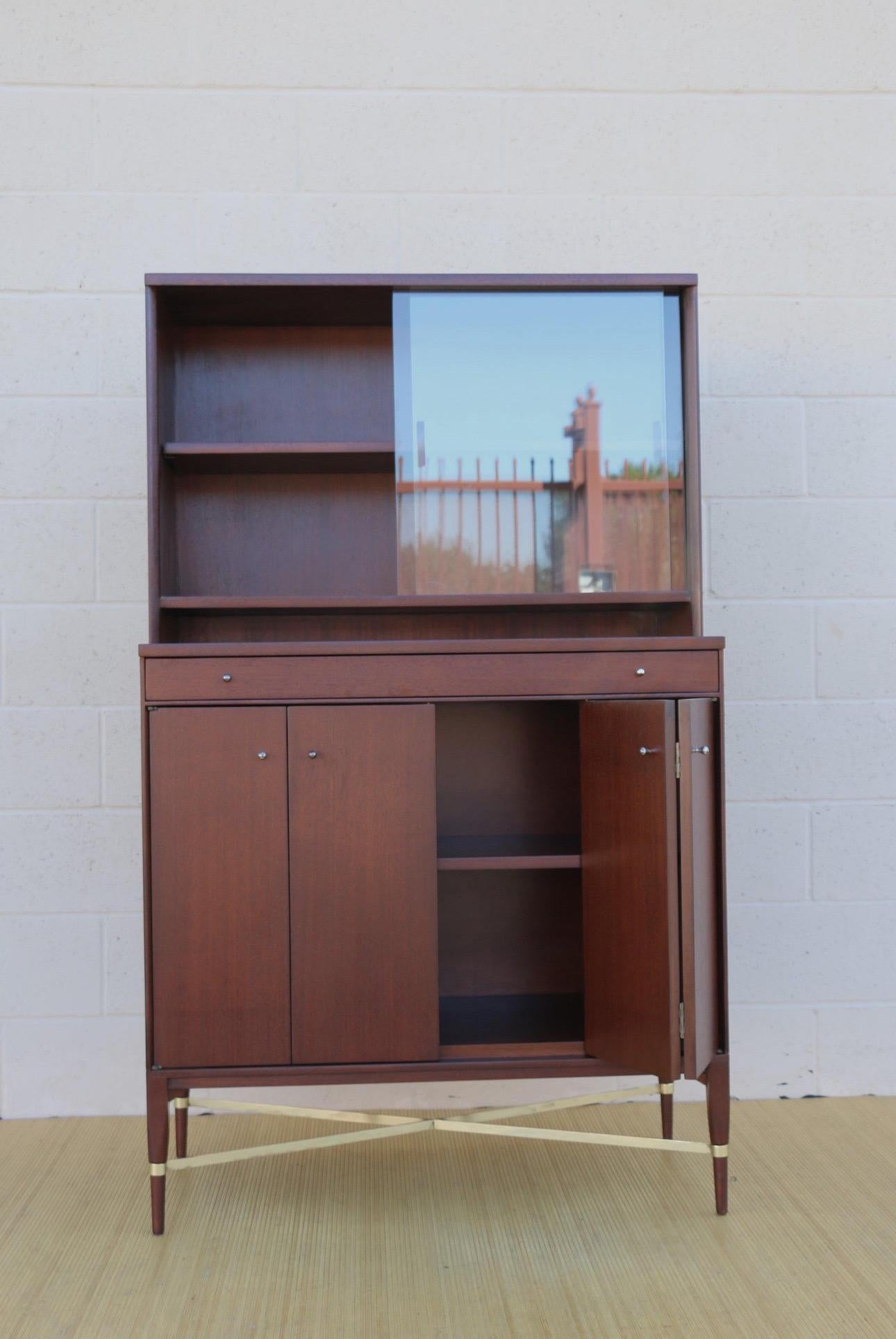 Mid-Century Modern 1950’s Paul McCobb China Cabinet With Disappearing Bifold Doors. For Sale