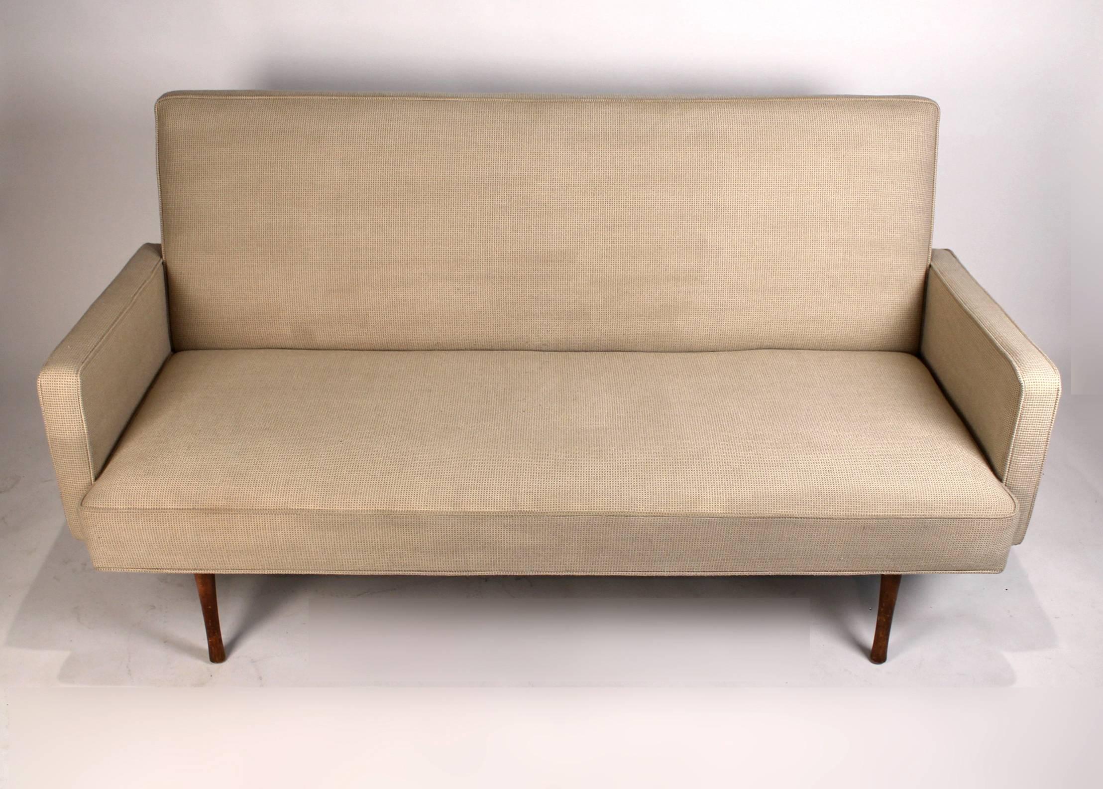 Early Planner Group sofa designed by Paul McCobb. This design is not common and seldom found. Original upholstery and finish intact.