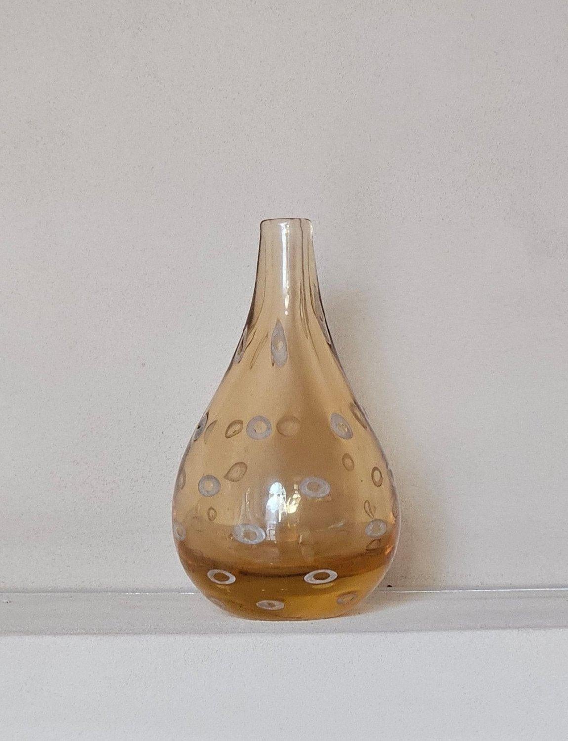 This exceptional Murano Glass vase was made in Venice by Pauly & Co in the 1950s. This vase is an exquisite peach golden colour and is decorated with white Murrine. Murrine are patterns or images made in glass canes that are revealed when the cane