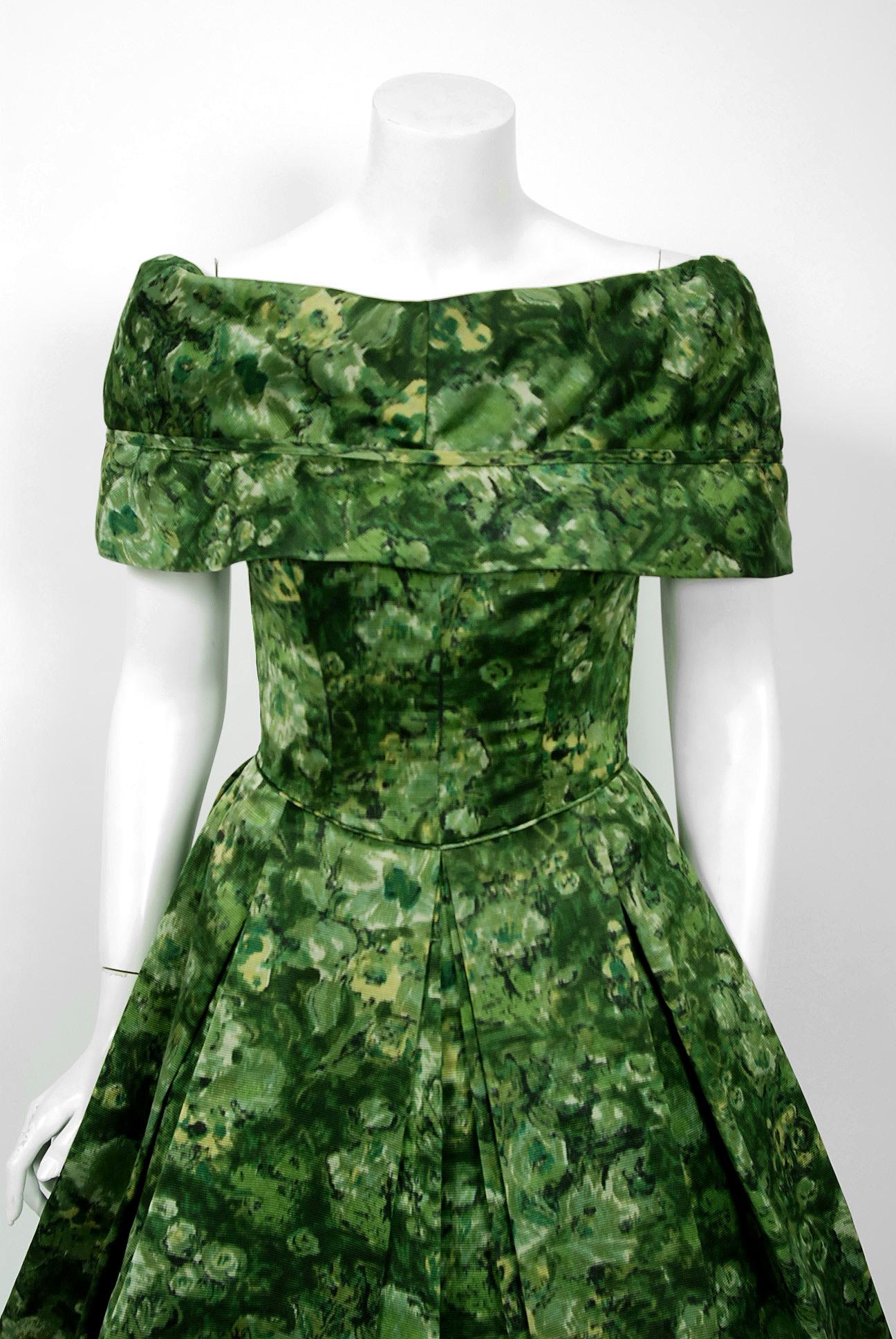 An amazing and highly stylized 1950's floral silk-faille dress by the famous American designer Peggy Hunt. Starting in the 1930's through the early 1960's, she was immensely successful with her specialized cocktail and evening looks. Her garments