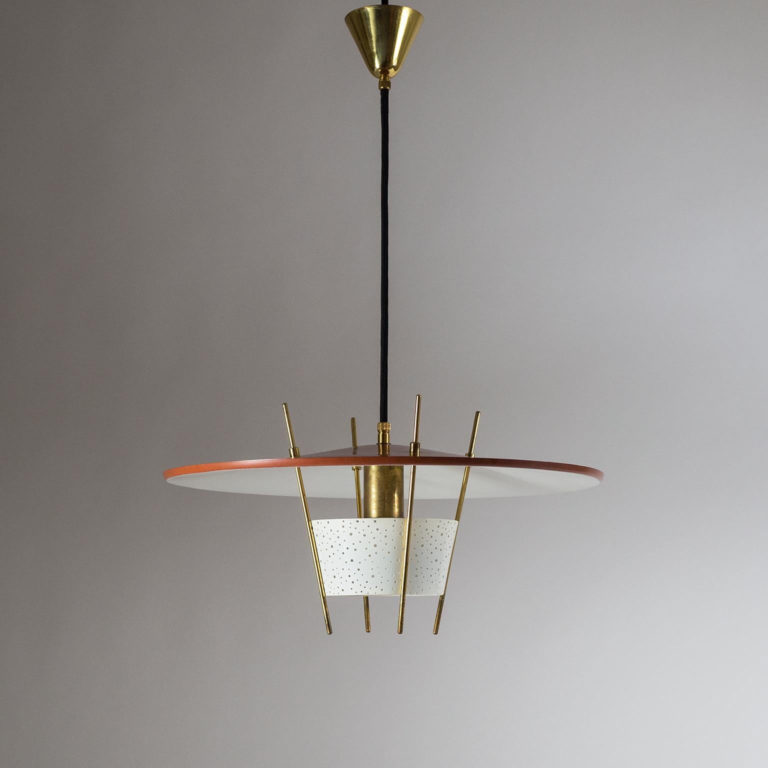 Unique and very rare pendant by Ernest Igl for Hillebrand, Germany 1950s. A densely perforated diffuser with holes of varying sizes is attached to the large dual-color shade with brass stems in an ingenious manner. Very fine original condition with