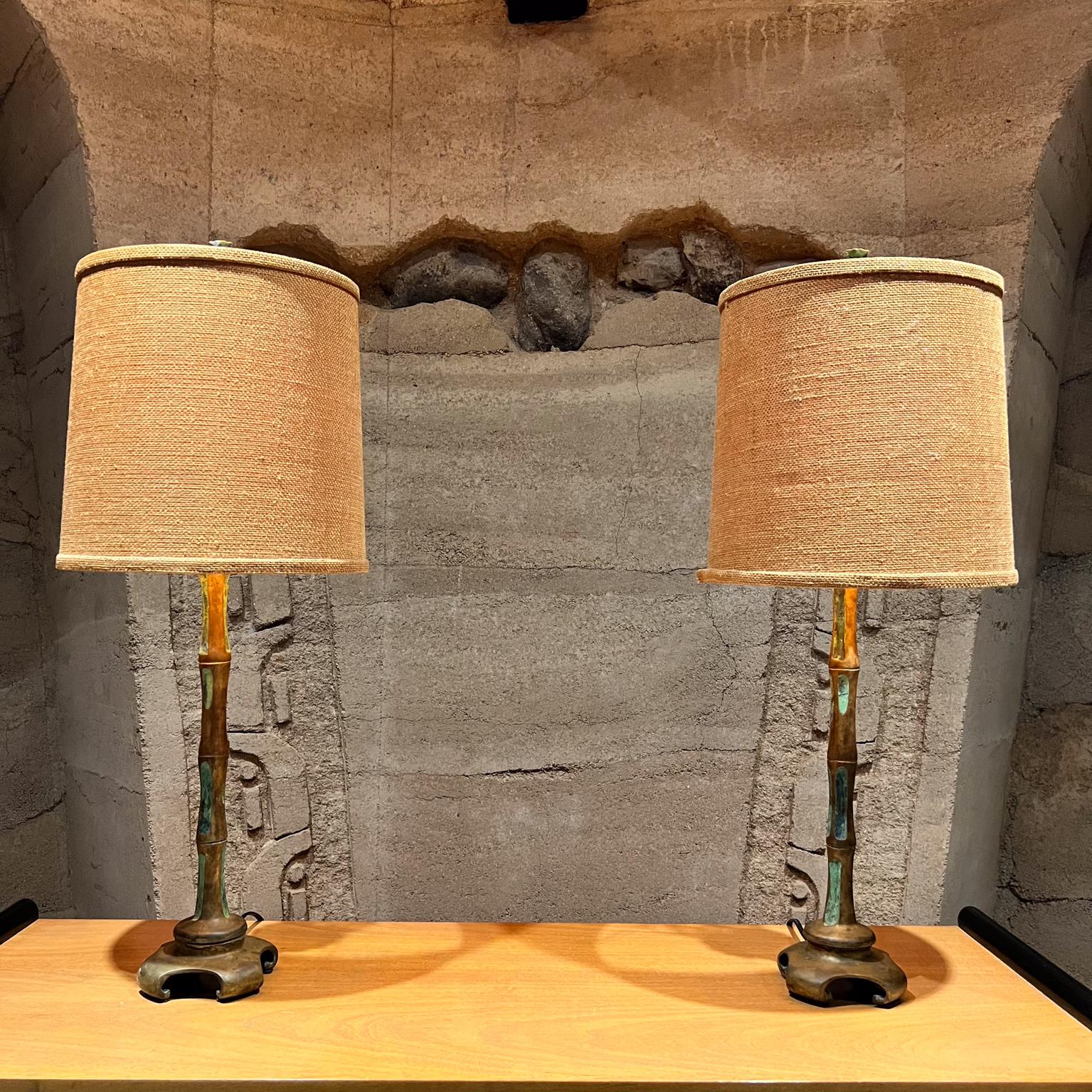 Fabulous Pair of Bronze Faux Bamboo Turquoise Table Lamps 
by artist Pepe Mendoza
1950s made in Mexico.
Designed in bronze with ceramic inlay of turquoise enamel.
21 to socket 5 x 5
Original Preowned Vintage Condition. 
Shades are not
