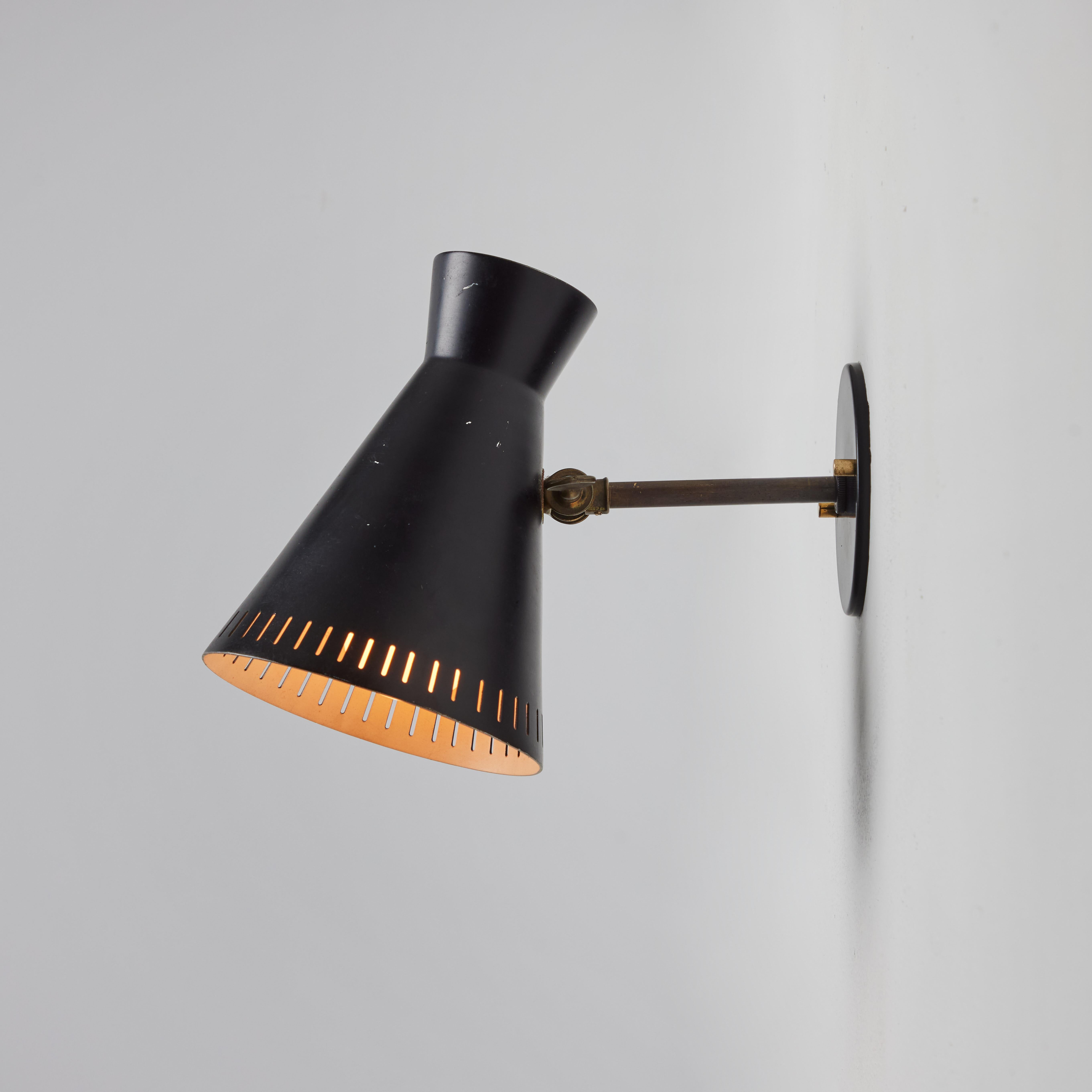 Scandinavian Modern 1950s Perforated Black Metal Diabolo Wall Lamp Attributed to Mauri Almari For Sale
