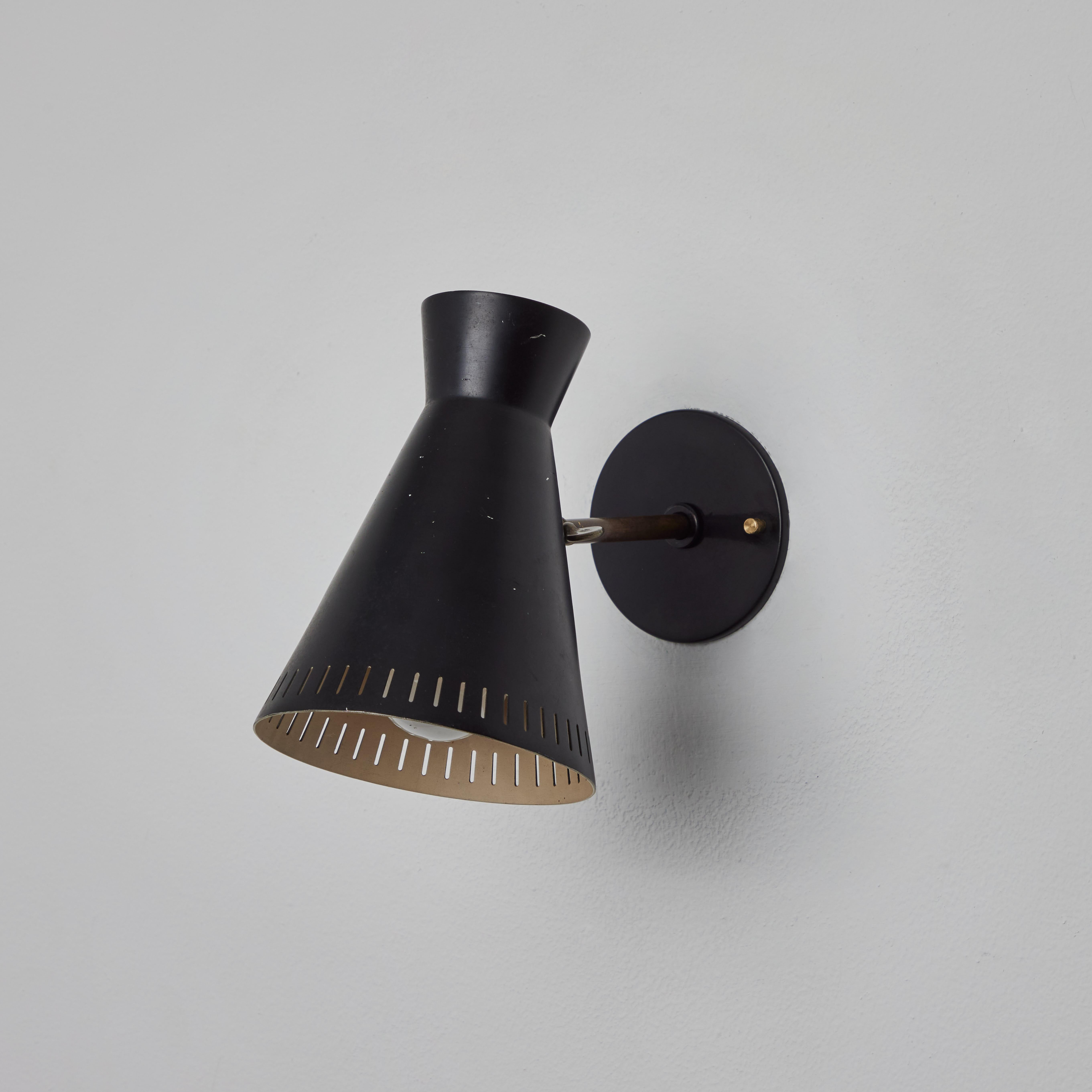 Finnish 1950s Perforated Black Metal Diabolo Wall Lamp Attributed to Mauri Almari For Sale